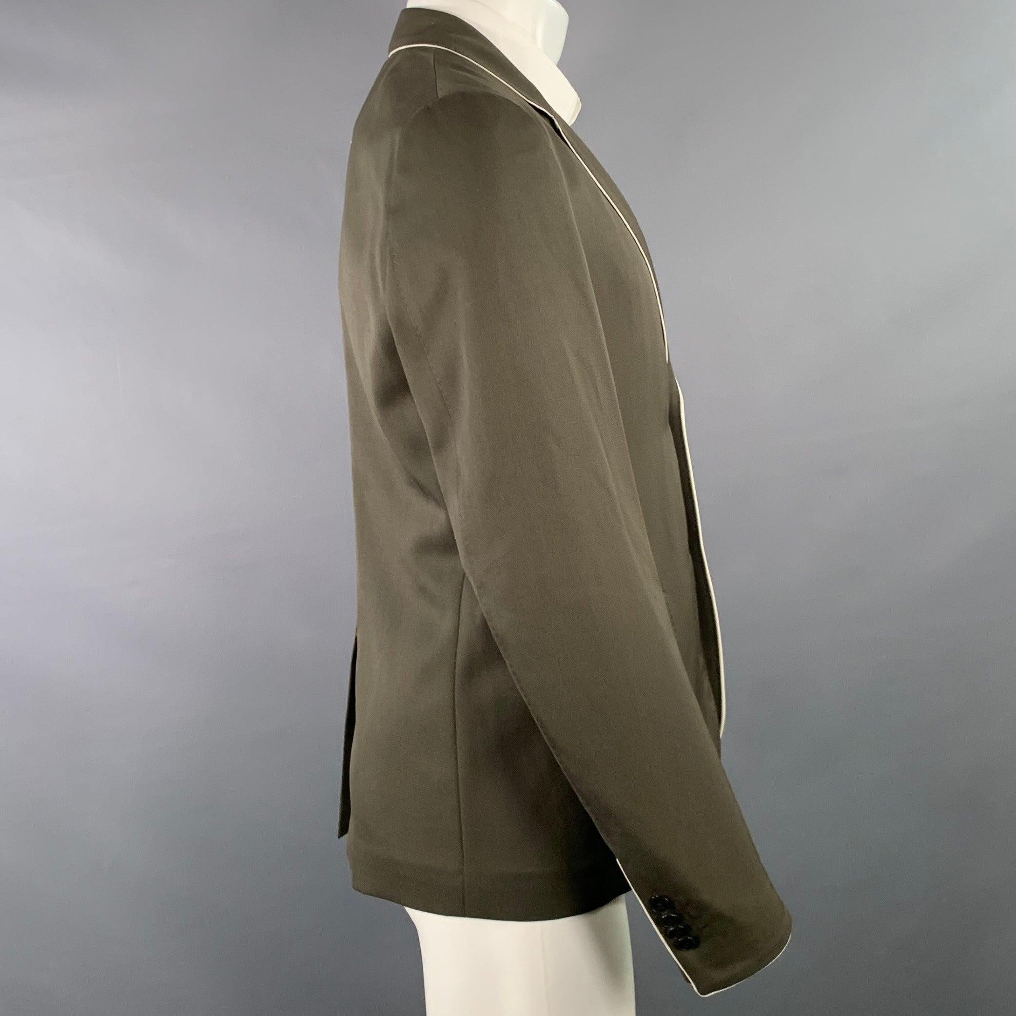 VALENTINO sport coat
in an olive green wool featuring contrasting white trim, notch lapel, single vented back, and double button closure. Made in Italy.Excellent Pre-Owned Condition. 

Marked:   IT 46 

Measurements: 
 
Shoulder: 16.5 inches Chest: