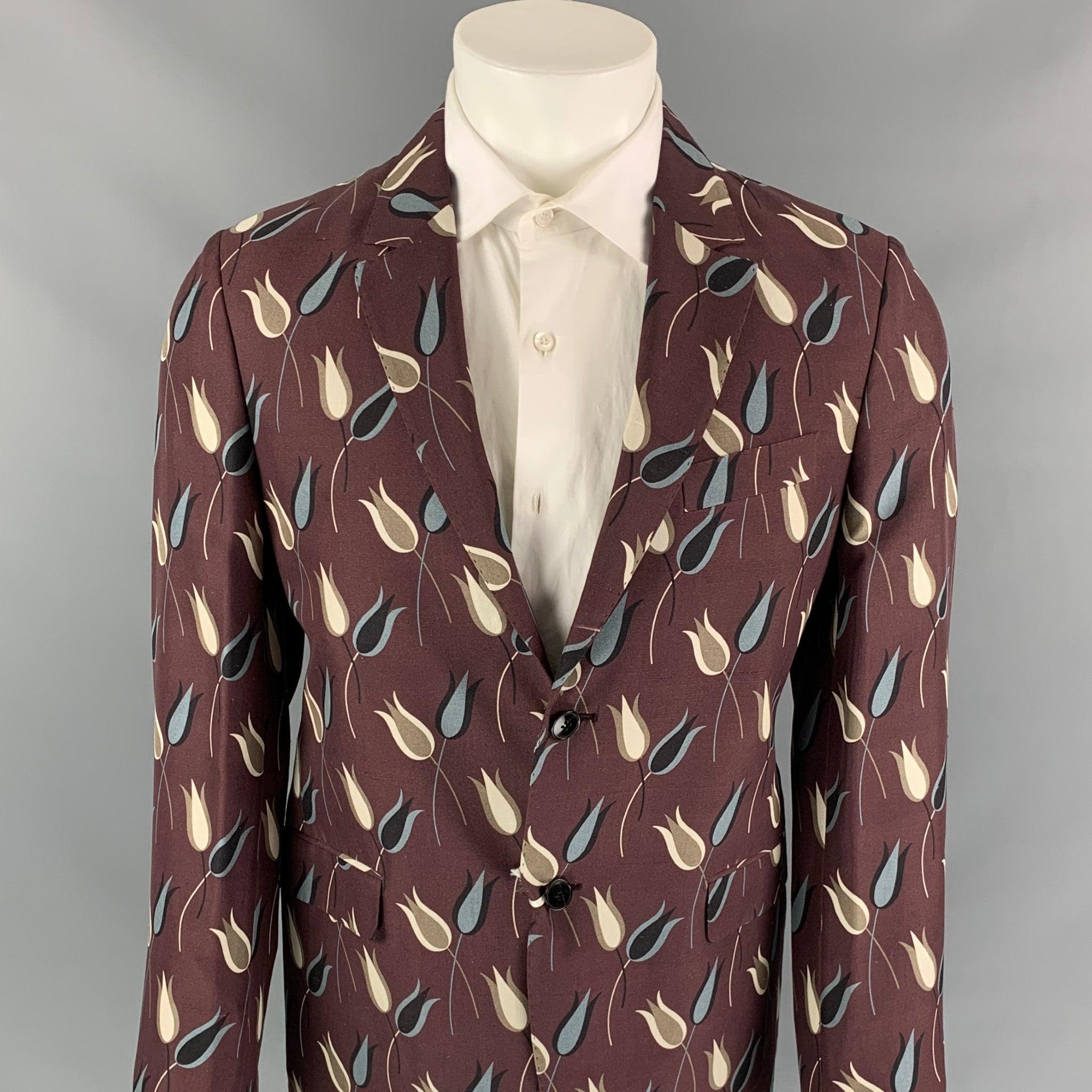 VALENTINO sport coat comes in a purple & grey floral silk featuring a notch lapel, flap pockets, and a two button closure. Made in Italy.New With Tags.
 

Marked:   48 

Measurements: 
 
Shoulder: 16.5 inches  Chest: 38 inches  Sleeve: 26.5 inches 