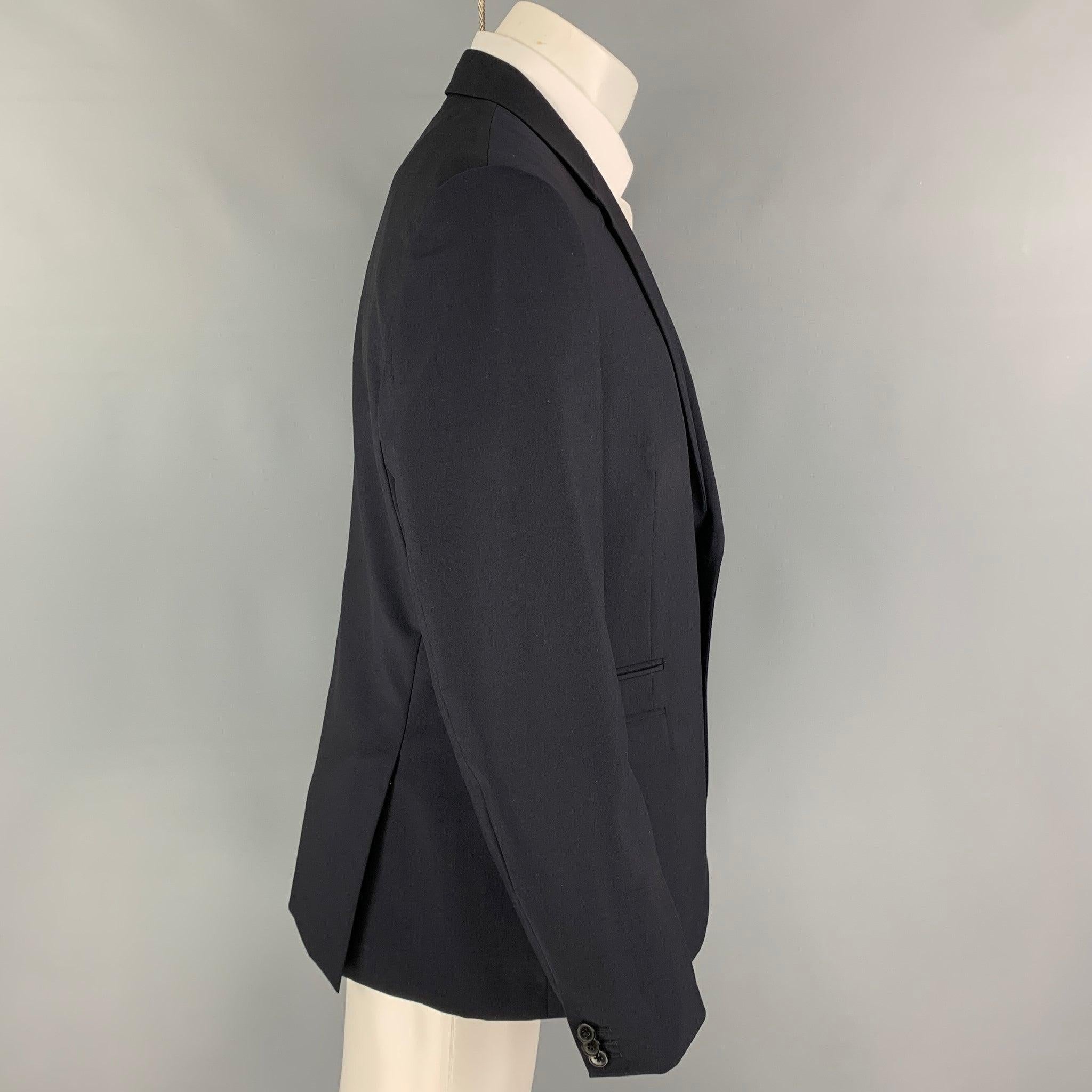 VALENTINO sport coat comes in a navy wool /mohair featuring a notch lapel, flap pockets, double back vent, and a double button closure. Made in Italy. Excellent Pre-Owned Condition. 

Marked:   52 

Measurements: 
 
Shoulder: 18.5 inches Chest: 42