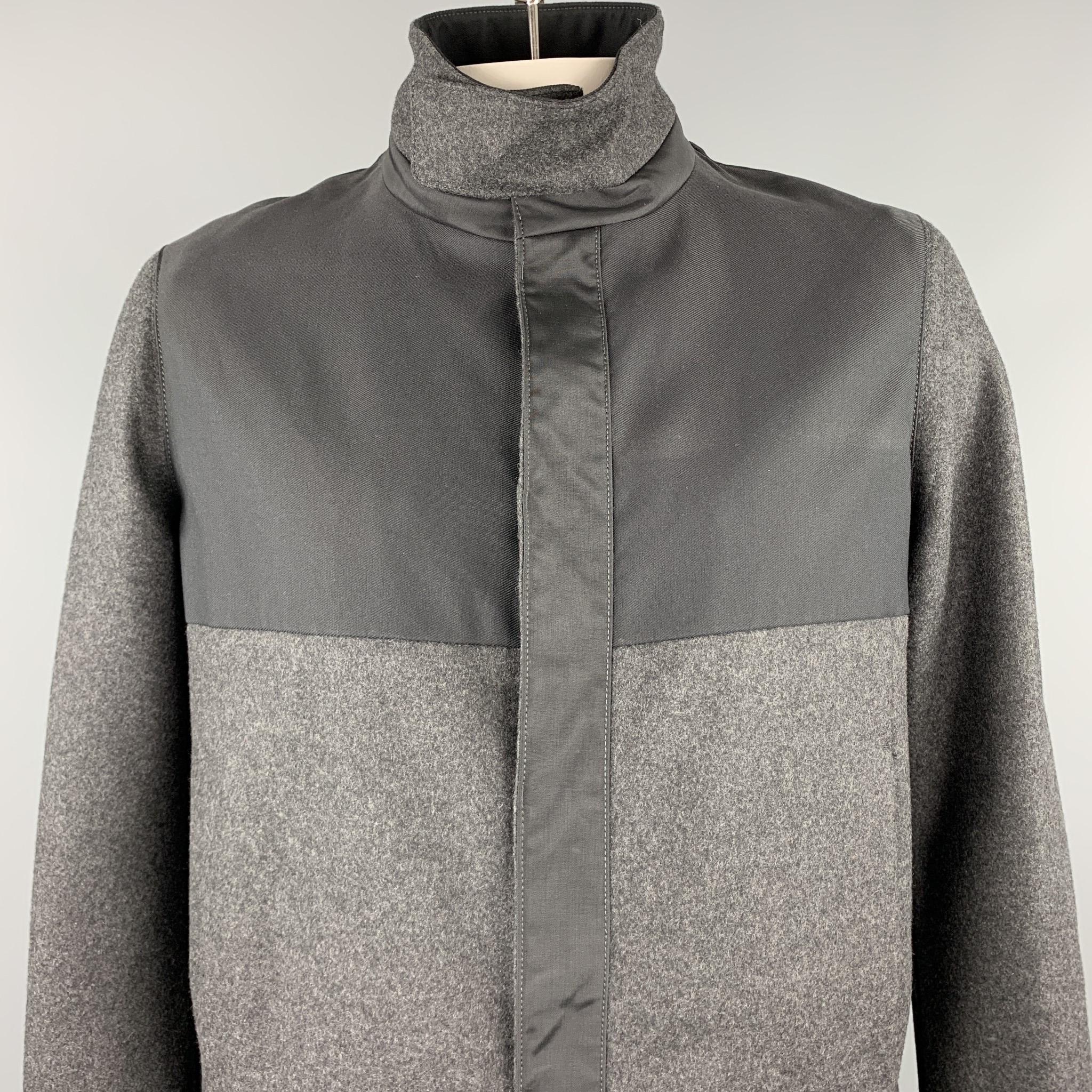 VALENTINO jacket comes in a charcoal & black mixed materials featuring a high collar, slit pockets, and a zip & snap button closure. Made in Italy.

New With Tags.
Marked: IT 54

Measurements:

Shoulder: 18.5 in. 
Chest: 44 in. 
Sleeve: 28 in.