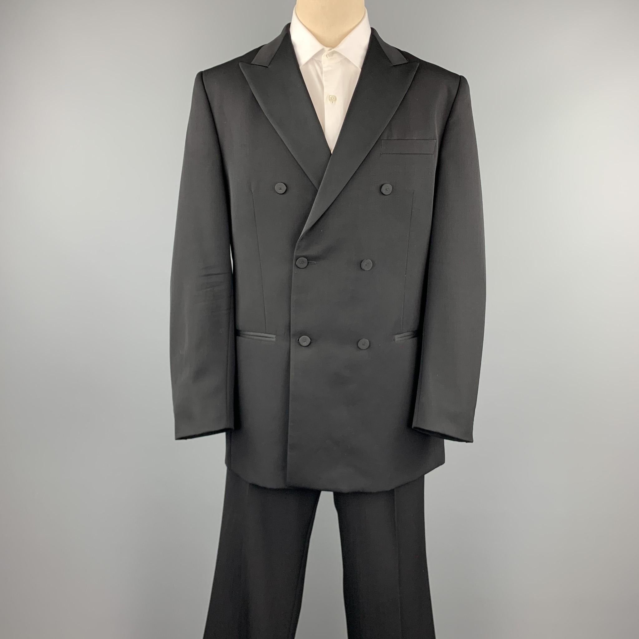 VALENTINO tuxedo suit comes in a black wool and includes a double breasted button sport coat with a peak lapel and matching flat front trousers. Made in Italy.

Very Good Pre-Owned Condition.
Marked: IT 56

Measurements:

-Jacket
Shoulder: 19 in.