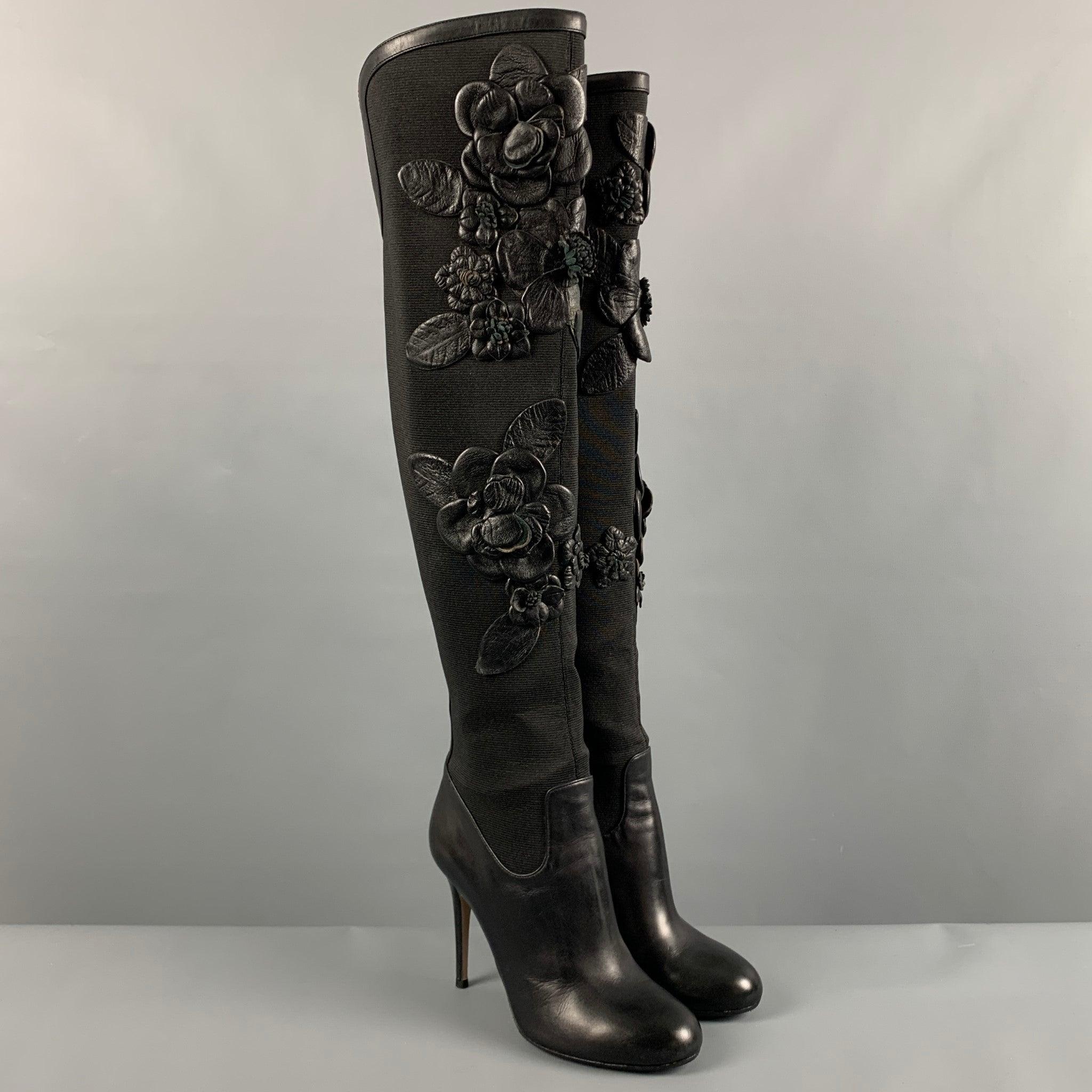 VALENTINO boots in a black nylon featuring over the knee style, leather flower appliques, and a back zipper closure. Made in Italy. Very Good Pre-Owned Condition. Minor signs of wear. 

Marked:   37 

Measurements: 
  Length: 7.5 inches Width: 3