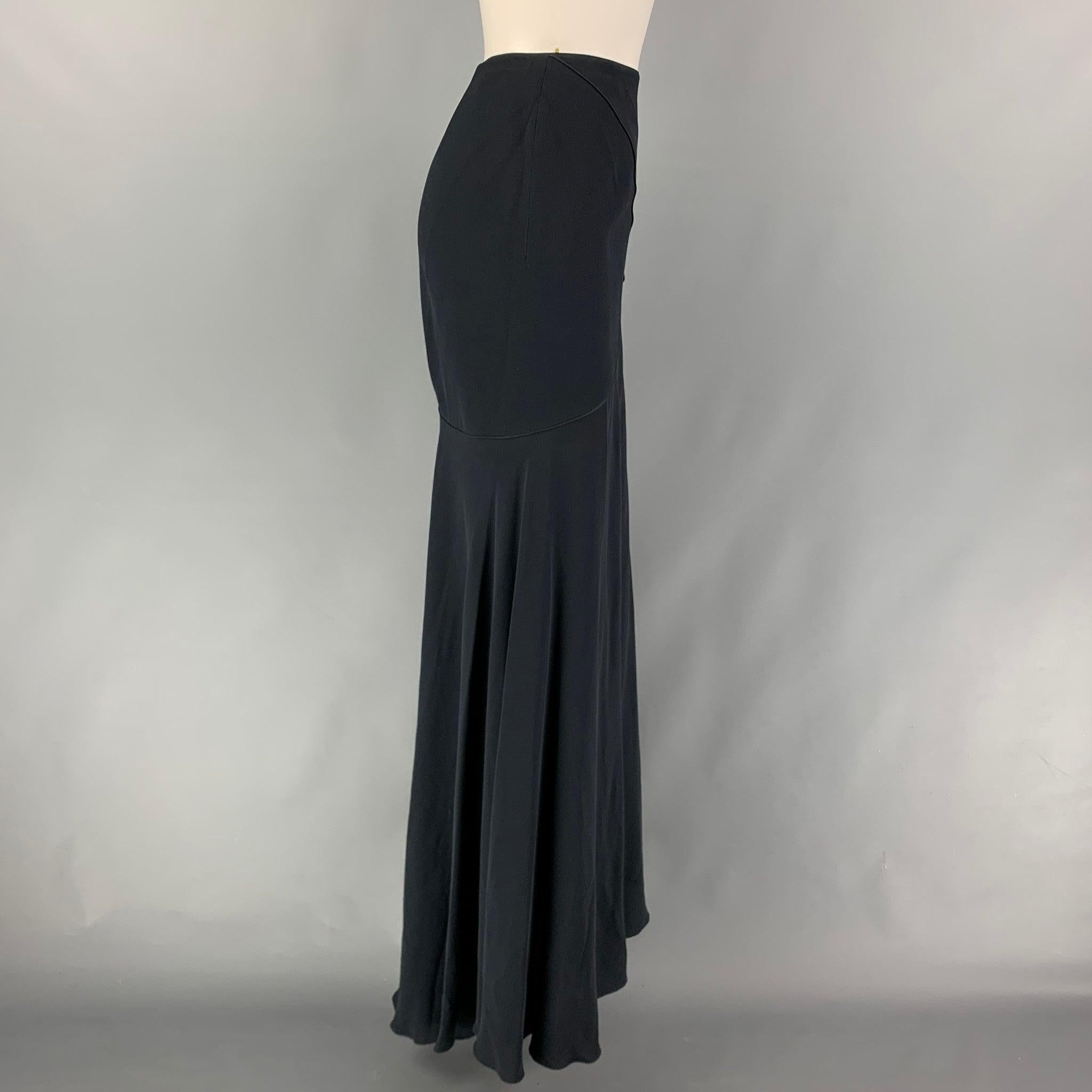 VALENTINO skirt comes in a black acetate blend featuring top stitching, front slit, and a back zipper closure.
Very Good
Pre-Owned Condition. 

Marked:   8 

Measurements: 
  Waist: 30 inches  Hip: 36 inches  Length: 48.5 inches 
  
  
 
Reference: