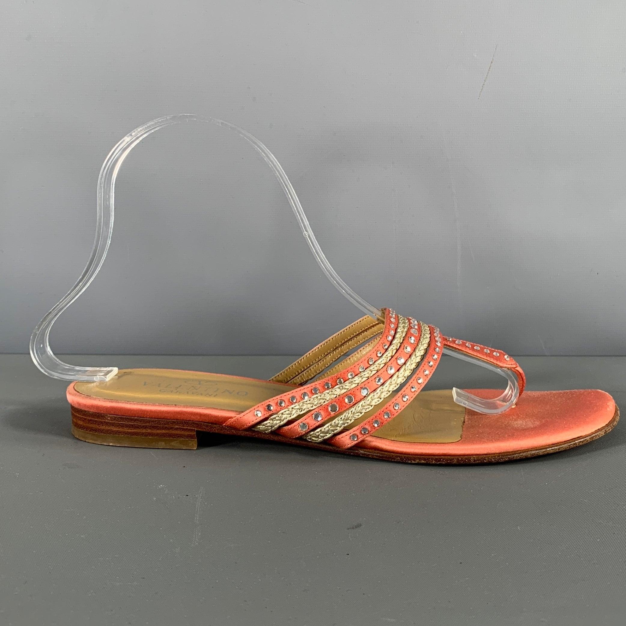 VALENTINO sandals come in pink satin material with silver tone breaded straps, thong strap and triangular strap panel with rhinestones details. Made in Italy.Very Good Pre-Owned Condition. Signs of wear. 

Marked:   IT 38Outsole: 10 x 3.75 inches 
