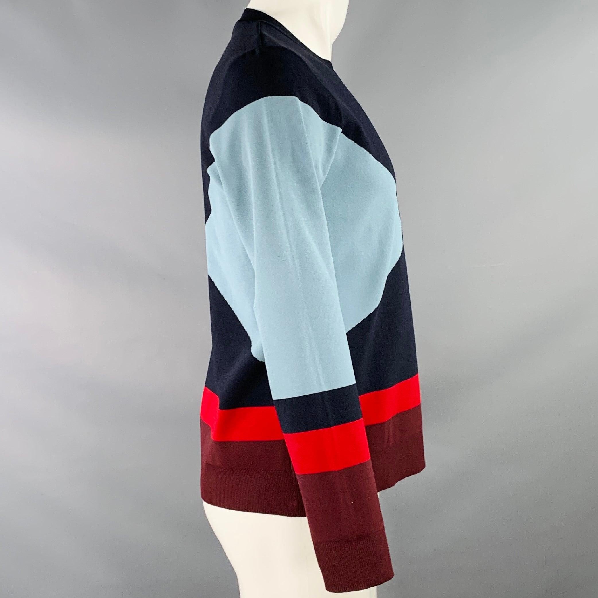 VALENTINO pullover
in a navy, blue, and red viscose blend fabric featuring a color block design, long sleeves, and crew neck. Made in Italy.Very Good Pre-Owned Condition. Minor pilling. 

Marked:   M 

Measurements: 
 
Shoulder: 15.5 inches Chest: