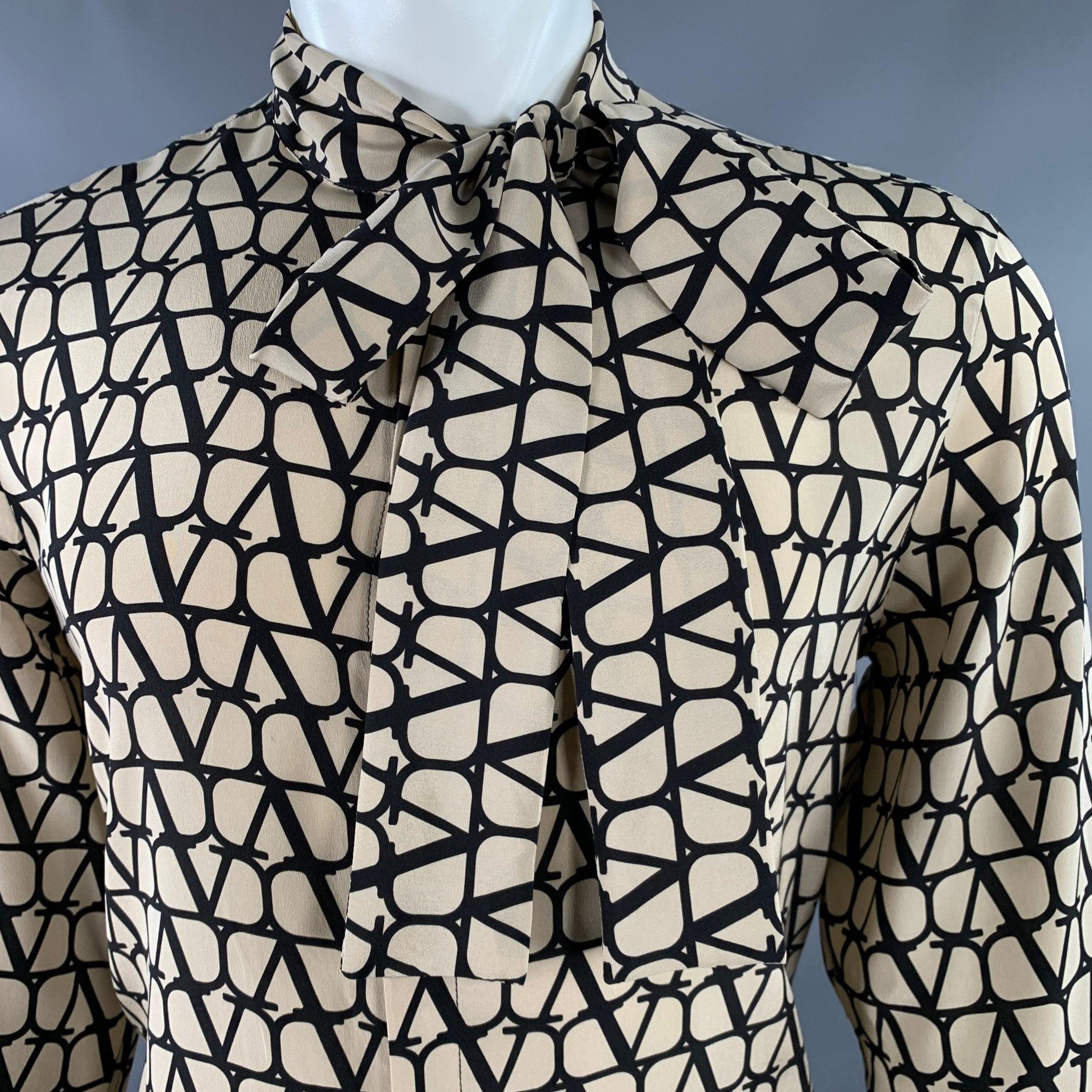 VALENTINO long sleeve shirt
in a
khaki and black cotton woven fabric featuring an all over Toile Iconographe monogram pattern, tie at neck, and hidden button closure. Made in Italy.Excellent Pre-Owned Condition. 

Marked:   40 

Measurements: 
