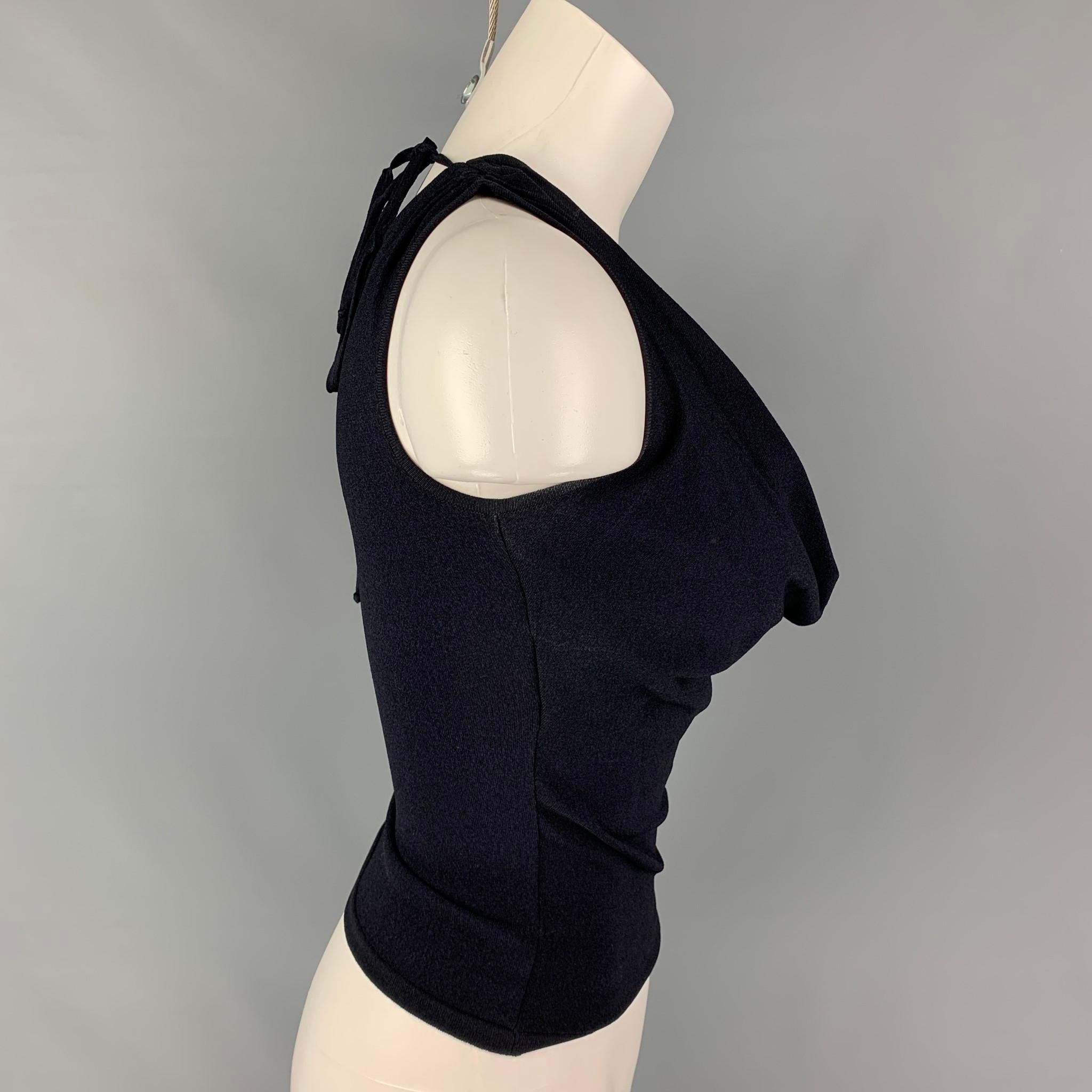 VALENTINO top comes in a navy viscose / polyester featuring a lace sequined panel, v-neck, sleeveless, and a back self tie detail.

Very Good Pre-Owned Condition.
Marked: S

Measurements:

Shoulder: 12.5 in.
Bust: 28 in.
Length: 16.5 in. 
