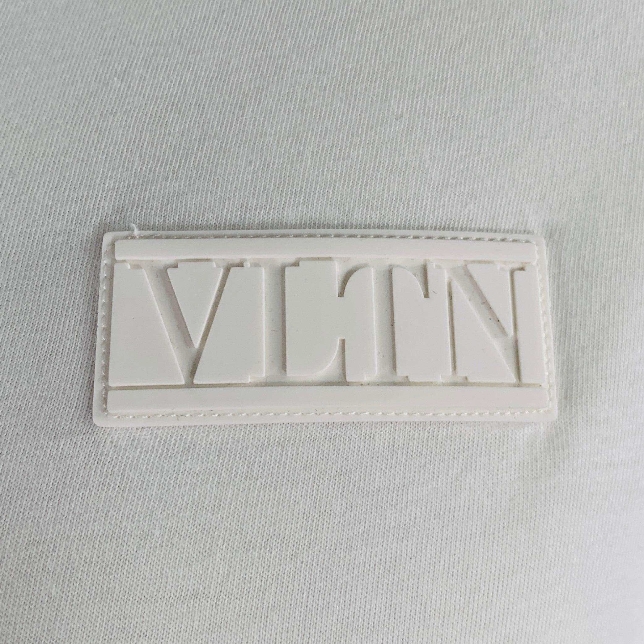 VALENTINO t-shirt
in a white cotton jersey featuring white rubber logo patch, short sleeves, and crew neck. Made in Italy.Excellent Pre-Owned Condition. 

Marked:   XL 

Measurements: 
 
Shoulder: 20 inches Chest: 48 inches Sleeve: 8.5 inches