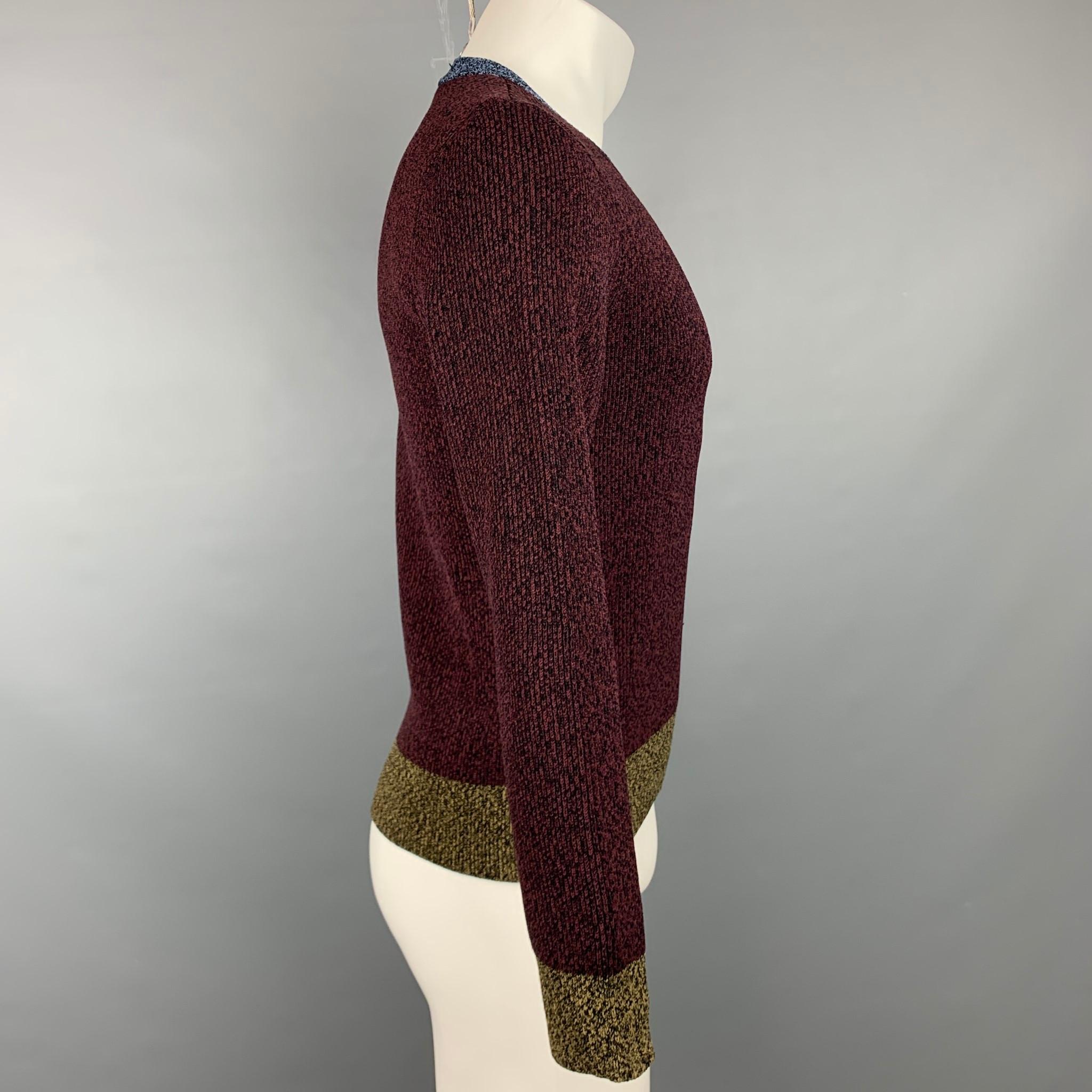 VALENTINO pullover comes in a burgundy & black heather viscose blend featuring a crew-neck. Made in Italy.

Very Good Pre-Owned Condition.
Marked: XS

Measurements:

Shoulder: 17 in.
Chest: 36 in.
Sleeve: 24.5 in.
Length: 23 in. 