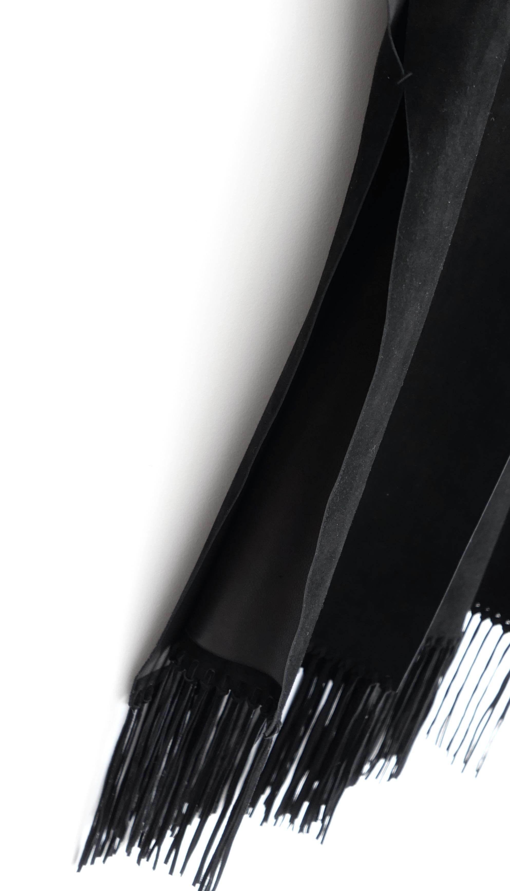 Gorgeous Valentino black suede poncho cape - from the Spring 2014 collection - look 36 on the runway. Bought for £6500 and unworn. Made from smooth black calf suede with long hand knotted fringing to the hem. It has a panelled cut with slit sides