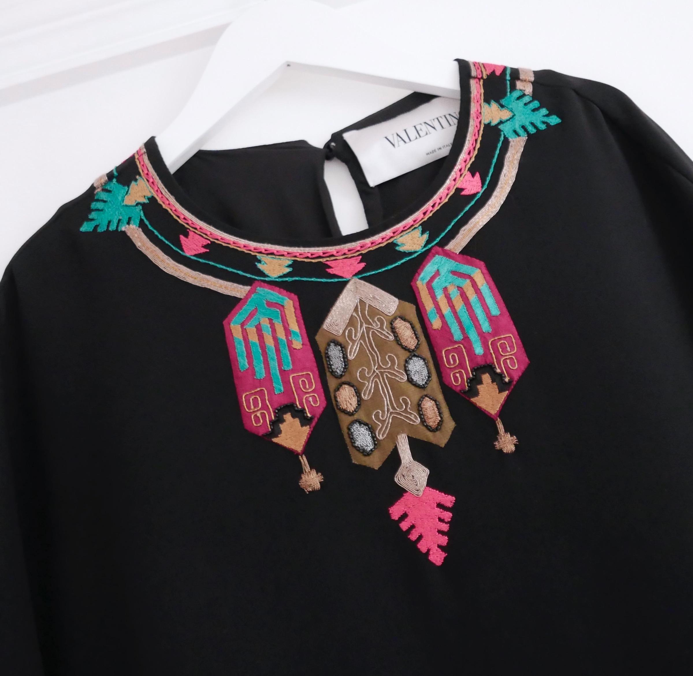 Absolutely beautiful Valentino embellished maxi dress from the Spring 2014 collection. Bought for £4750 and worn once. Made from fluid black silk crepe with stunning Egyptian inspired appliqué and embroidery to the neckline. It has a super easy to