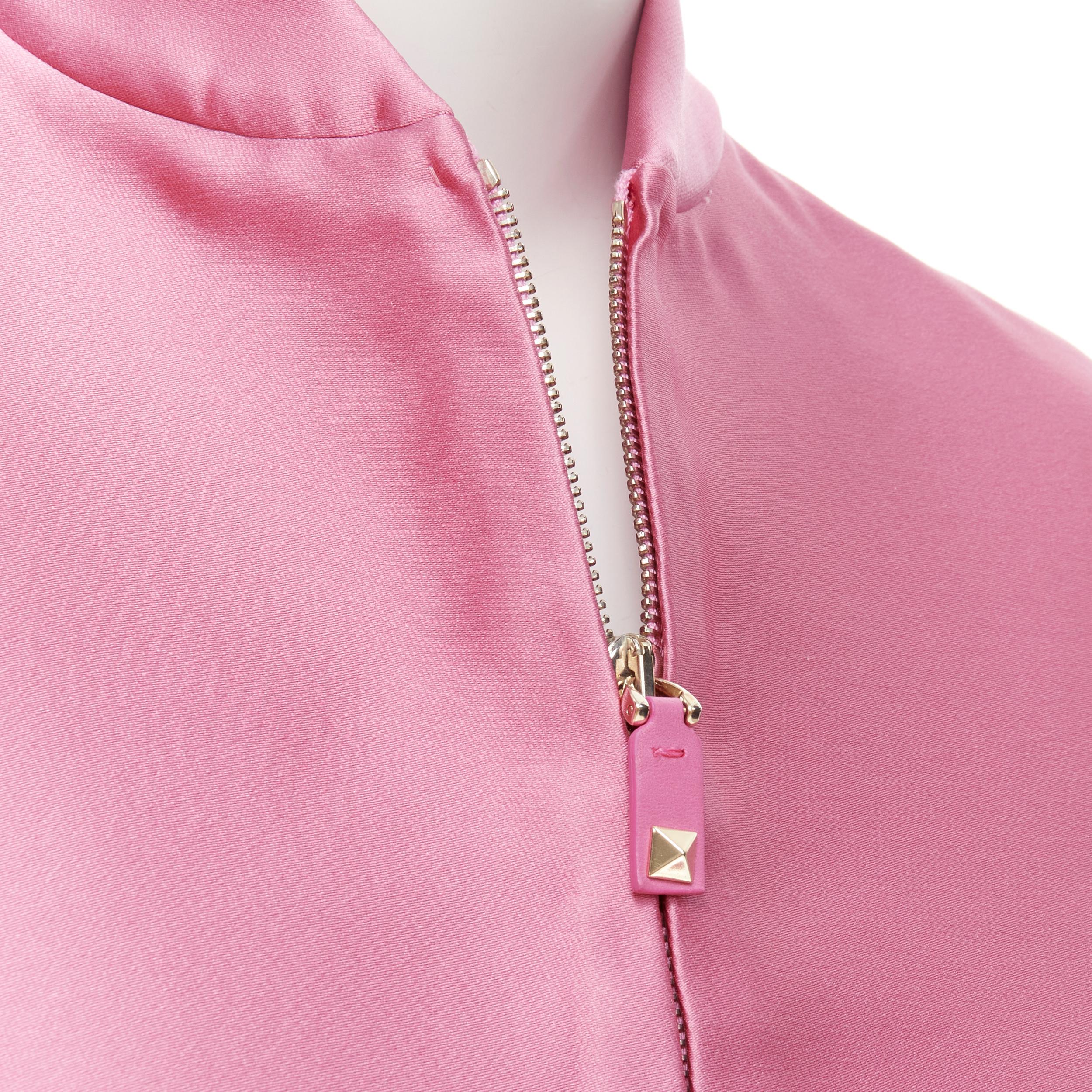 VALENTINO Sub Zero Couture pink polyester silk flared hem bomber jacket IT36 XS 
Reference: TGAS/B02046 
Brand: Valentino 
Collection: Sub Zeo Couture 
Material: Polyeser 
Color: Pink 
Pattern: Solid 
Closure: Zip 
Extra Detail: Zip front. Rockstud