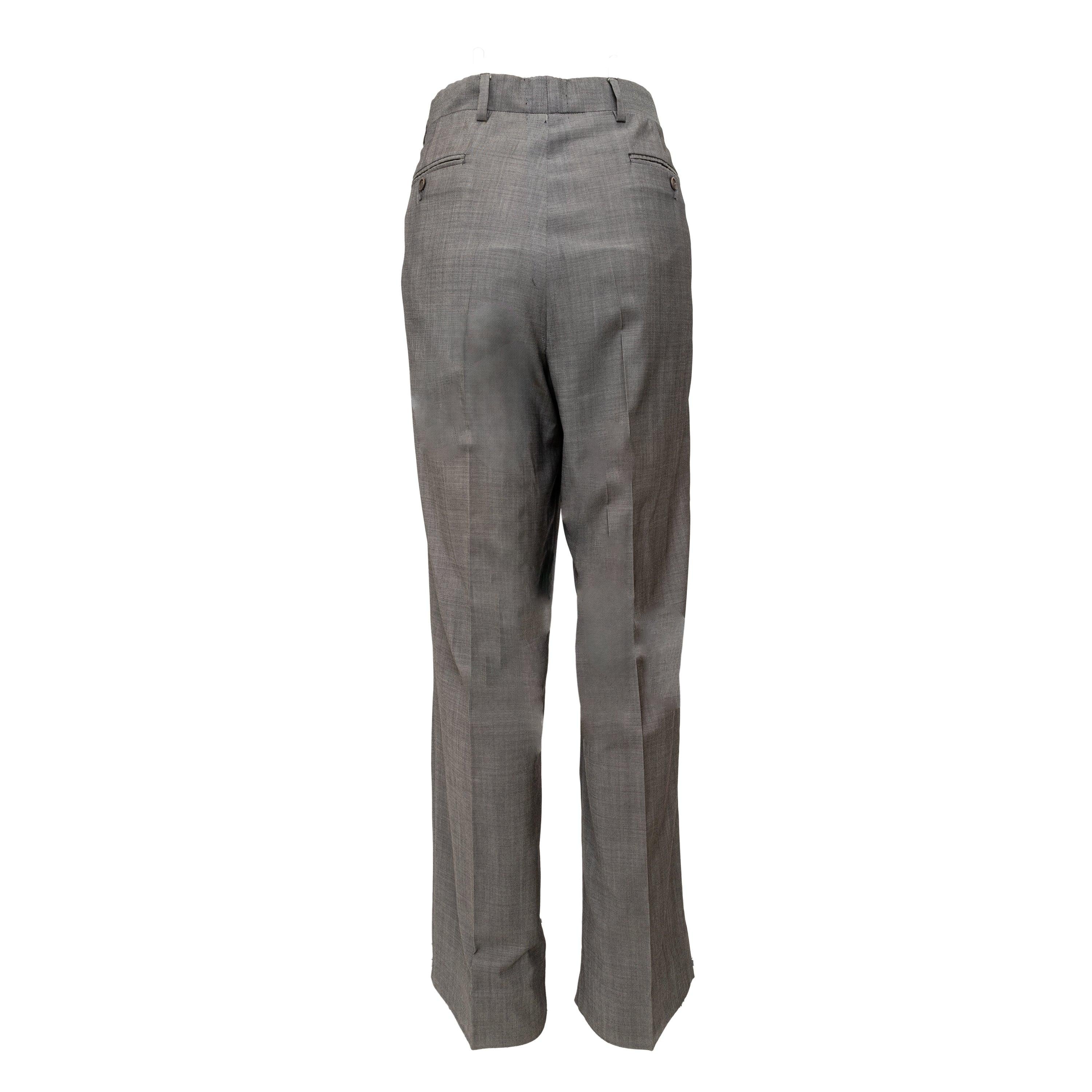 Expertly made from the finest Super 120's wool, the Valentino pants offer a sleek and tailored look. With a front button and zipper closure, these light grey pants provide both style and comfort. Enhance your wardrobe with this high-quality,