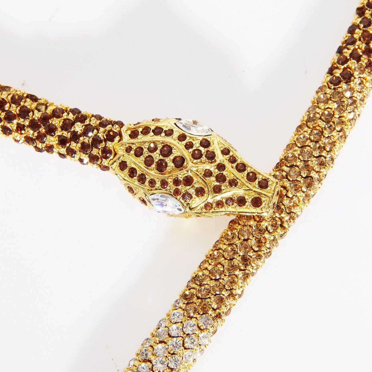 A stunning example of finely crafted costume jewelry from the historically significant 20th century Italian Haute Couture designer Valentino
Garavani. The coiled nature of the 24 karat  gold plated links with the painstakingly placed pavé Austrian