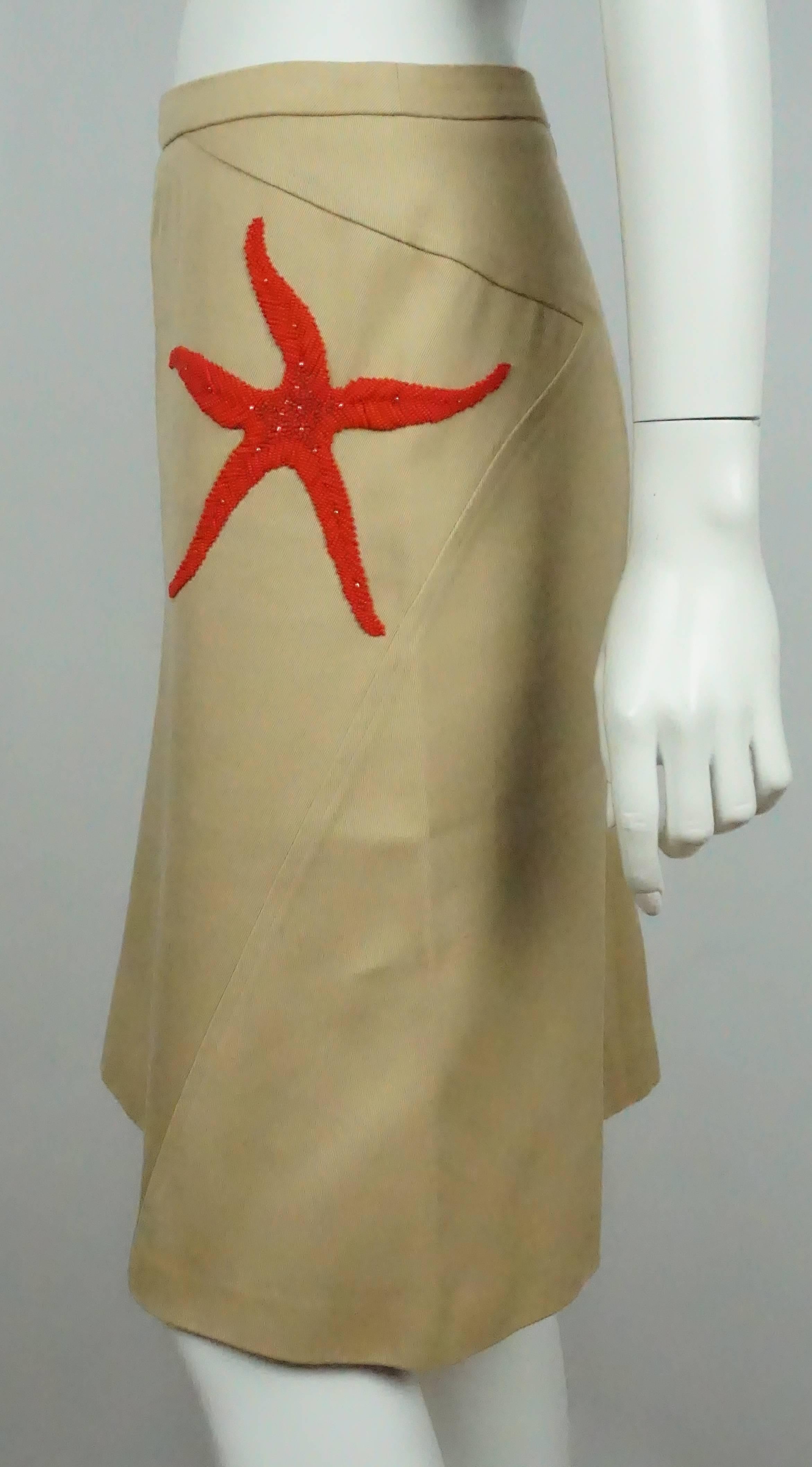 Valentino Tan Cotton Skirt W/ Red Beaded Starfish - 42  This simple skirt is in good condition. The skirt is completely made from cotton and has a red embroidery starfish on the left hip that is made out of beads. The skirt is made asymmetrically so