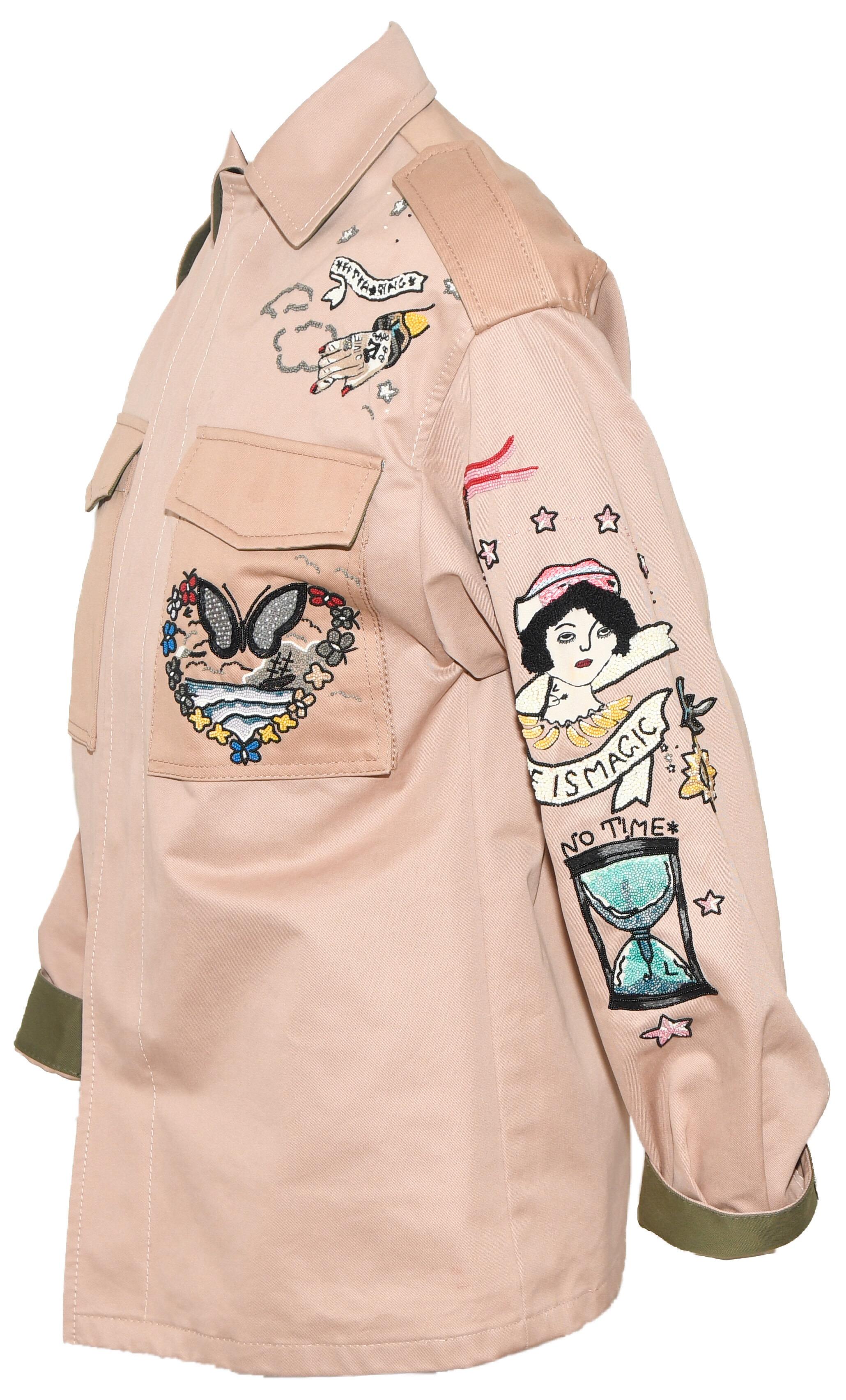 Valentino tan cotton canvas jacket proves that Garavani is much more than just gowns.  The many and varied appliques on this jacket instill a desire to live for the moment.  