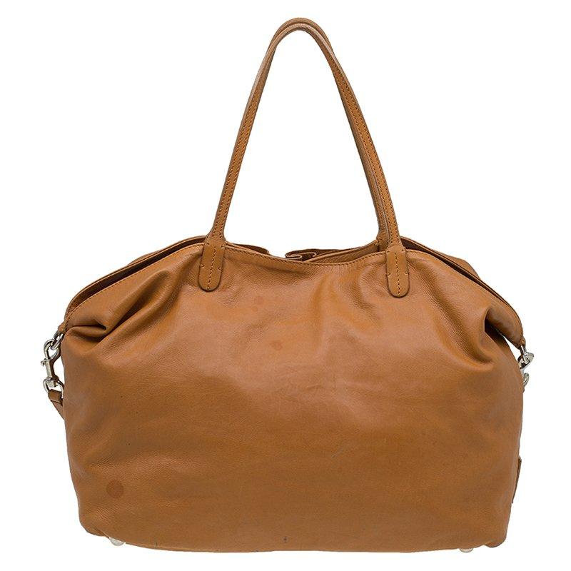 A chic, casual tote for everyday excursions crafted in luscious Nappa leather with a beautiful rose petal design on the front, this tote scores a brownie point in the art of accessorizing. Available in XL size, this casual tote bag comes with a