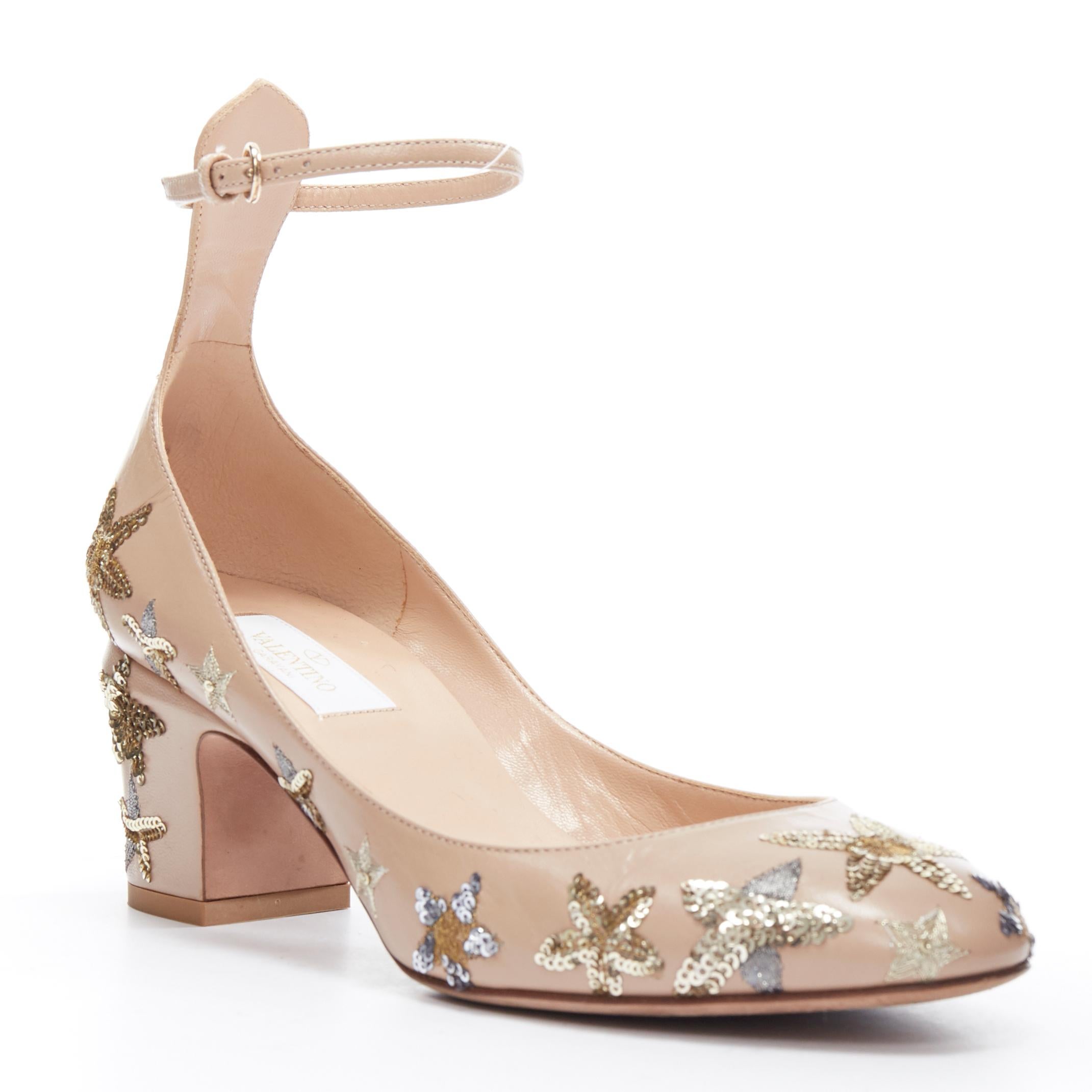 VALENTINO Tango nude gold star embroidered block heel ankle strap pump EU37.5 
Reference: LNKO/A01219 
Brand: Valentino 
Model: Tango 
Material: Leather 
Color: Beige 
Pattern: Solid 
Closure: Ankle Strap 
Extra Detail: Mid (22.9 in) heel height.