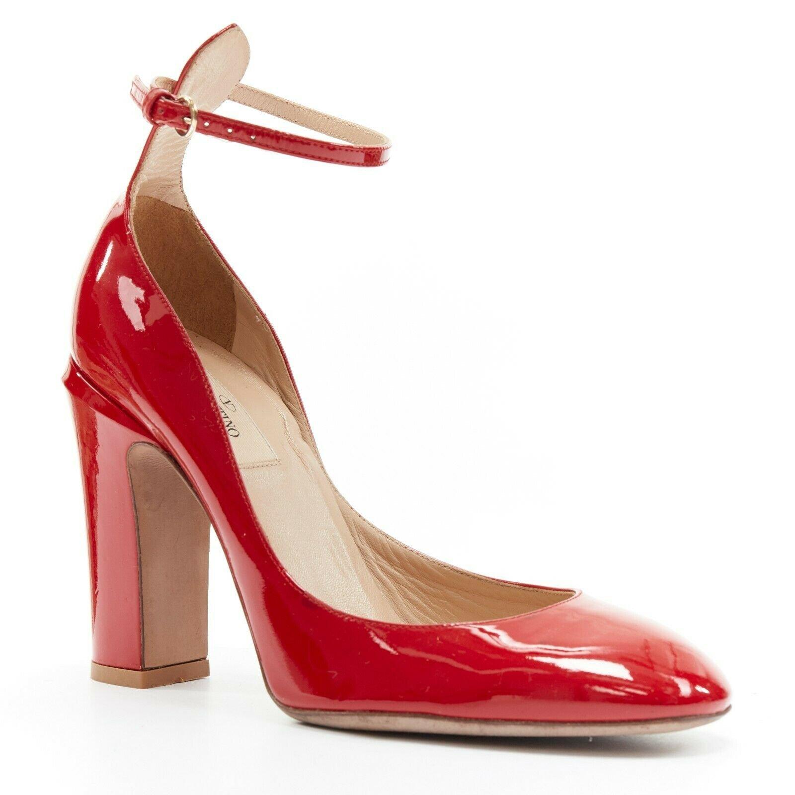 VALENTINO Tango red patent leather ankle strap round toe chunky heel pump EU39 
Reference: TGAS/A03152 
Brand: Valentino 
Model: Valentino Tango 
Material: Patent Leather 
Color: Red 
Pattern: Solid 
Closure: Ankle Strap 
Extra Detail: Tango heels.