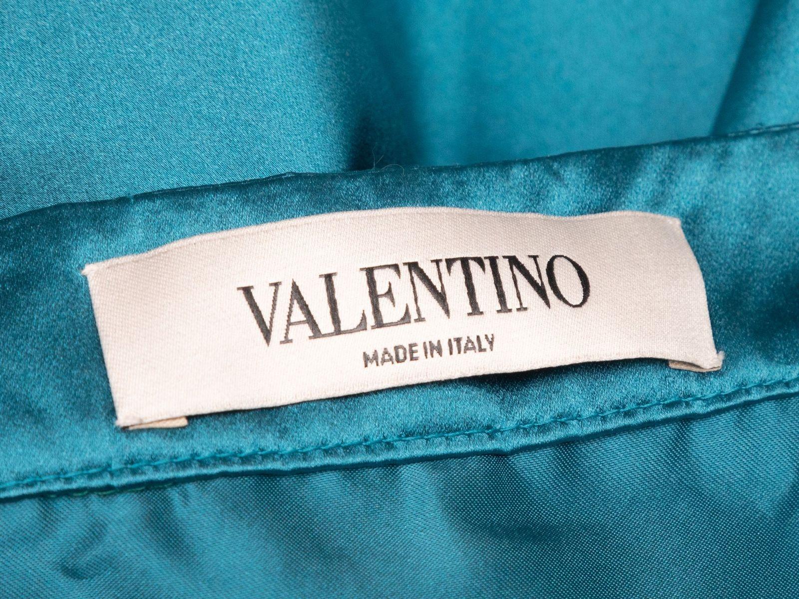 roduct Details: Teal silk maxi skirt by Valentino. Slit at side. 31