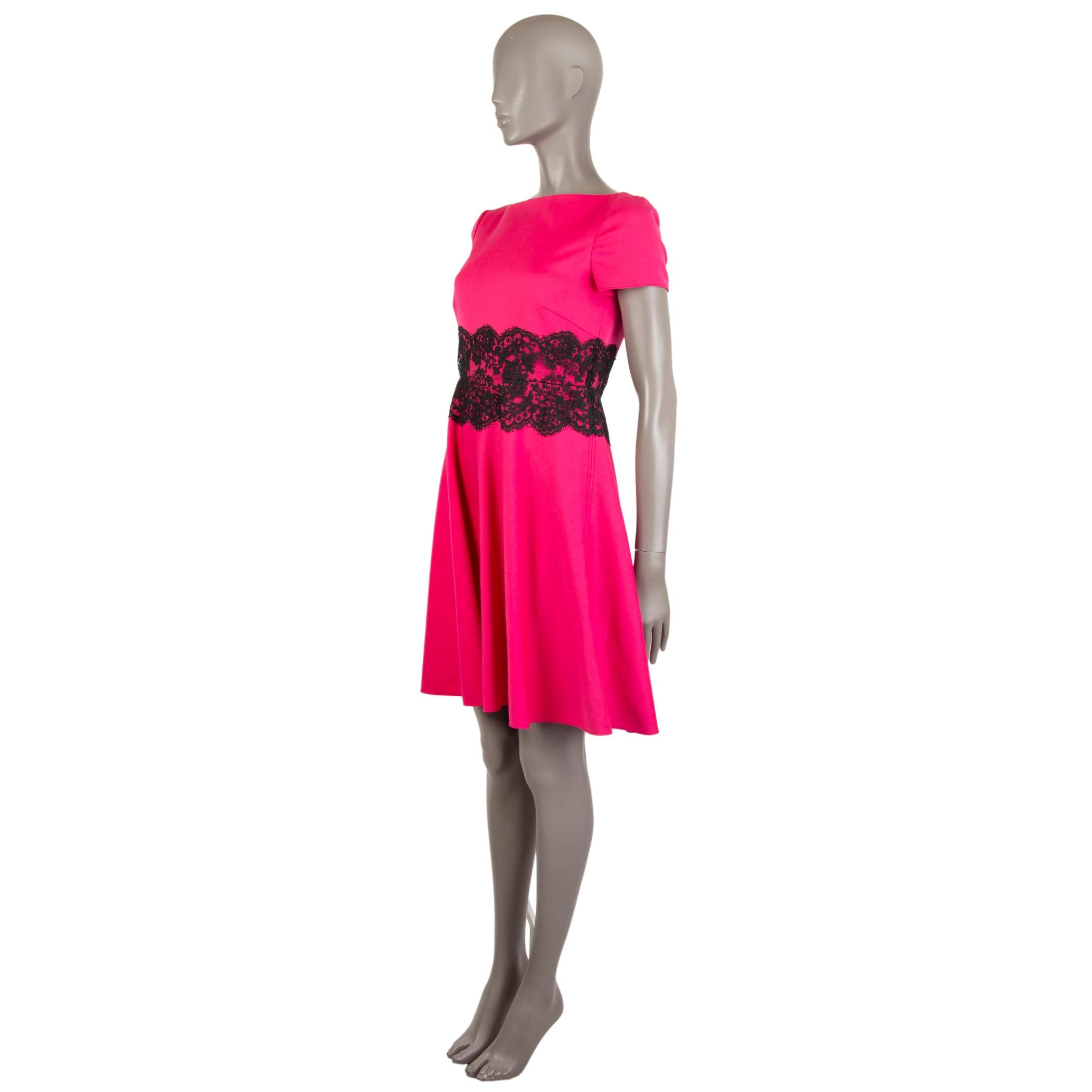 Valentino Techocouture short.sleeve dress in fucsia wool (90%), nylon (8%), and elastane (2%). With lace panel around the waist in black cotton (75%) and nylon (25%). Closes with hook and invisible zipper on the back. Lined in fucsia polyester (96%)