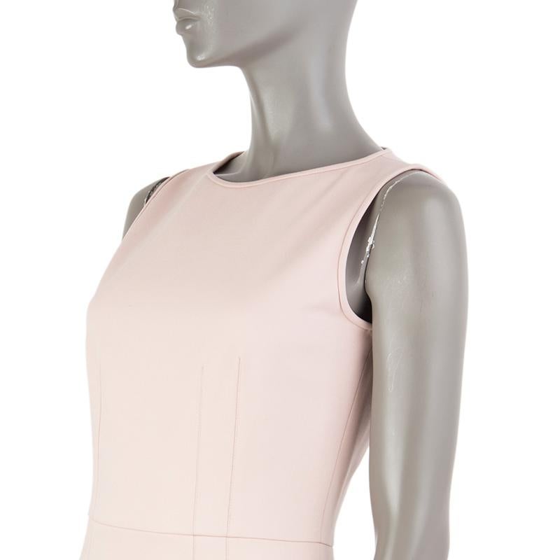 Valentino Technocouture sheath dress in pale rose fleece wool (98%) and elastane (2%). With piping around the neck and arms and slit on the back of the skirt. Closes with hook and invisible zipper on the back. Lined in nude polyester (96%) and