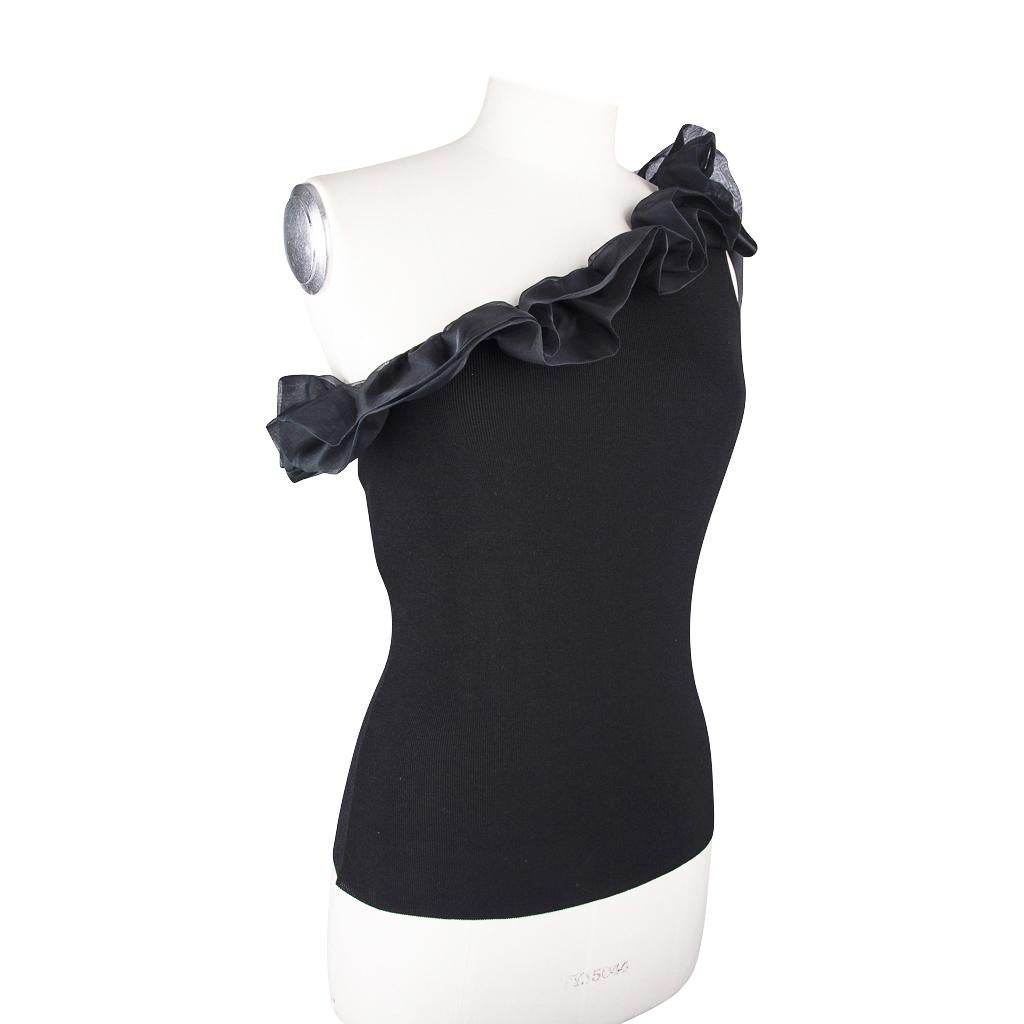Mightychic offers a Valentino one shoulder top with ruffle and bow trim in silk.
Black knit fitted top.
Double layer black silk ruffle trims 'neckline'.
Signature bow detail at the shoulder.
Fresh, charming and chic!
Fabric is cotton, viscose and