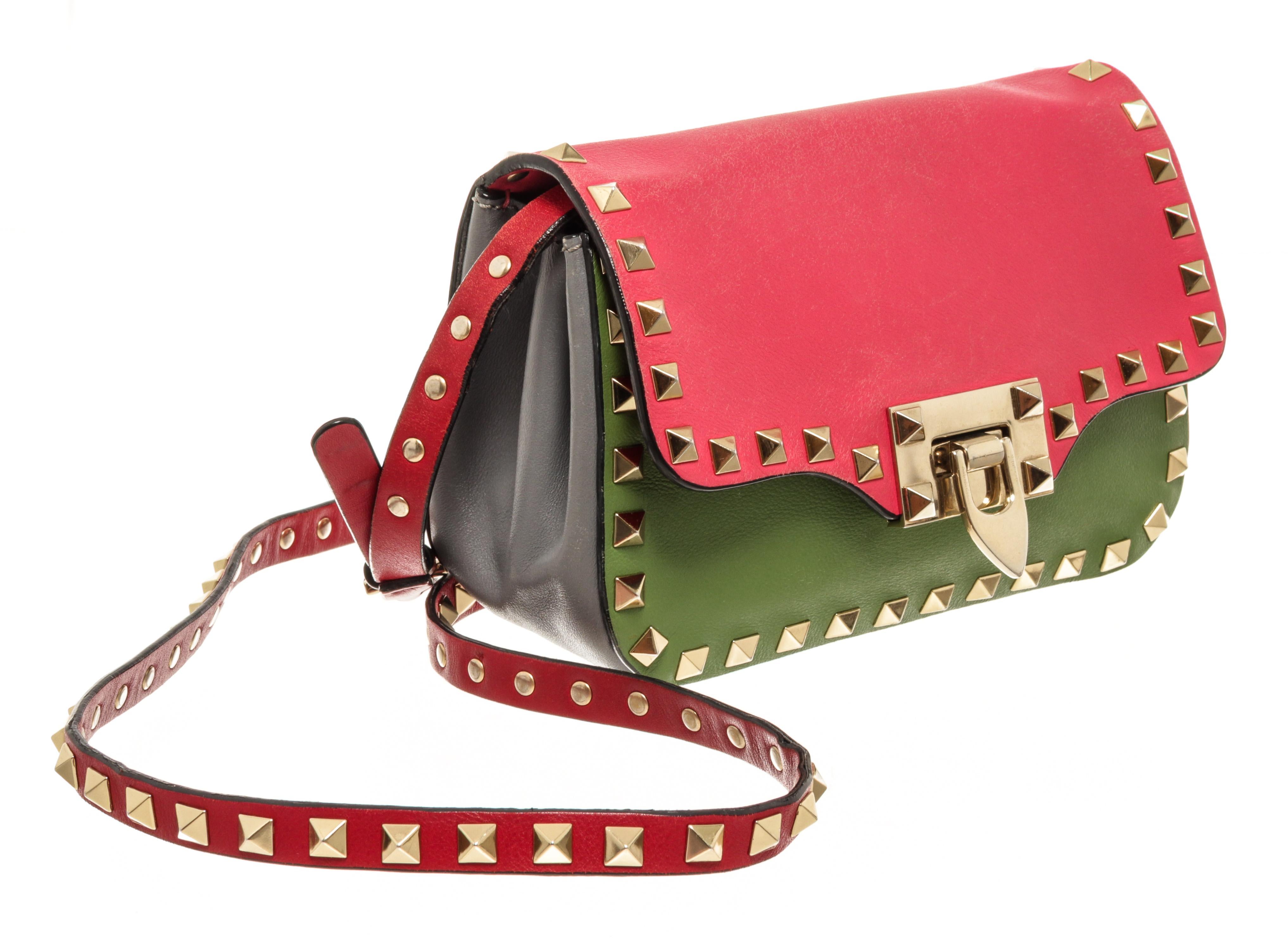 Valentino Tricolor Leather Rockstud Flip Lock Flap Mini Bag with gold-tone hardware, Valentino rockstuds detailing all over the edge and the strap, beige canvas lining, interior slip pocket, adjustable leather shoulder crossbody strap, and a flap