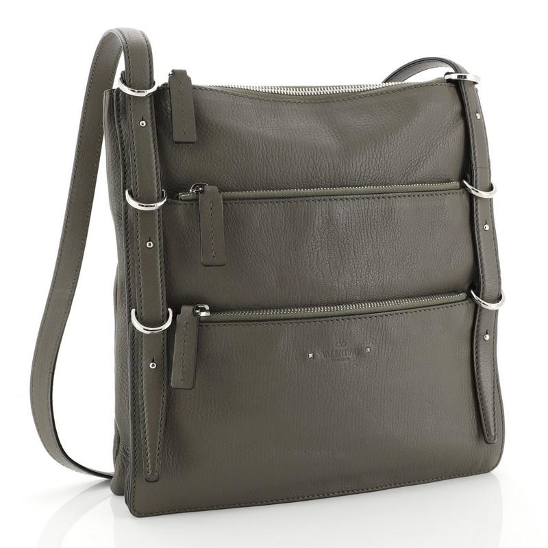 This Valentino Triple Zip Shoulder Bag Leather Medium, crafted from green leather, features a leather shoulder strap, exterior zip pockets, and silver-tone hardware. Its zip closure opens to a black fabric interior. 

Estimated Retail Price:
