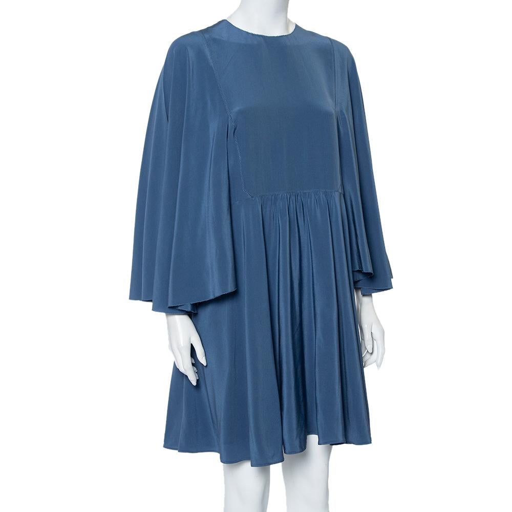 This mini dress from Valentino is surely a statement number that will help you outline a chic look. It features a pleated silhouette below the waist and flaunts a round neckline and cape sleeves. It is equipped with a concealed zip closure at the