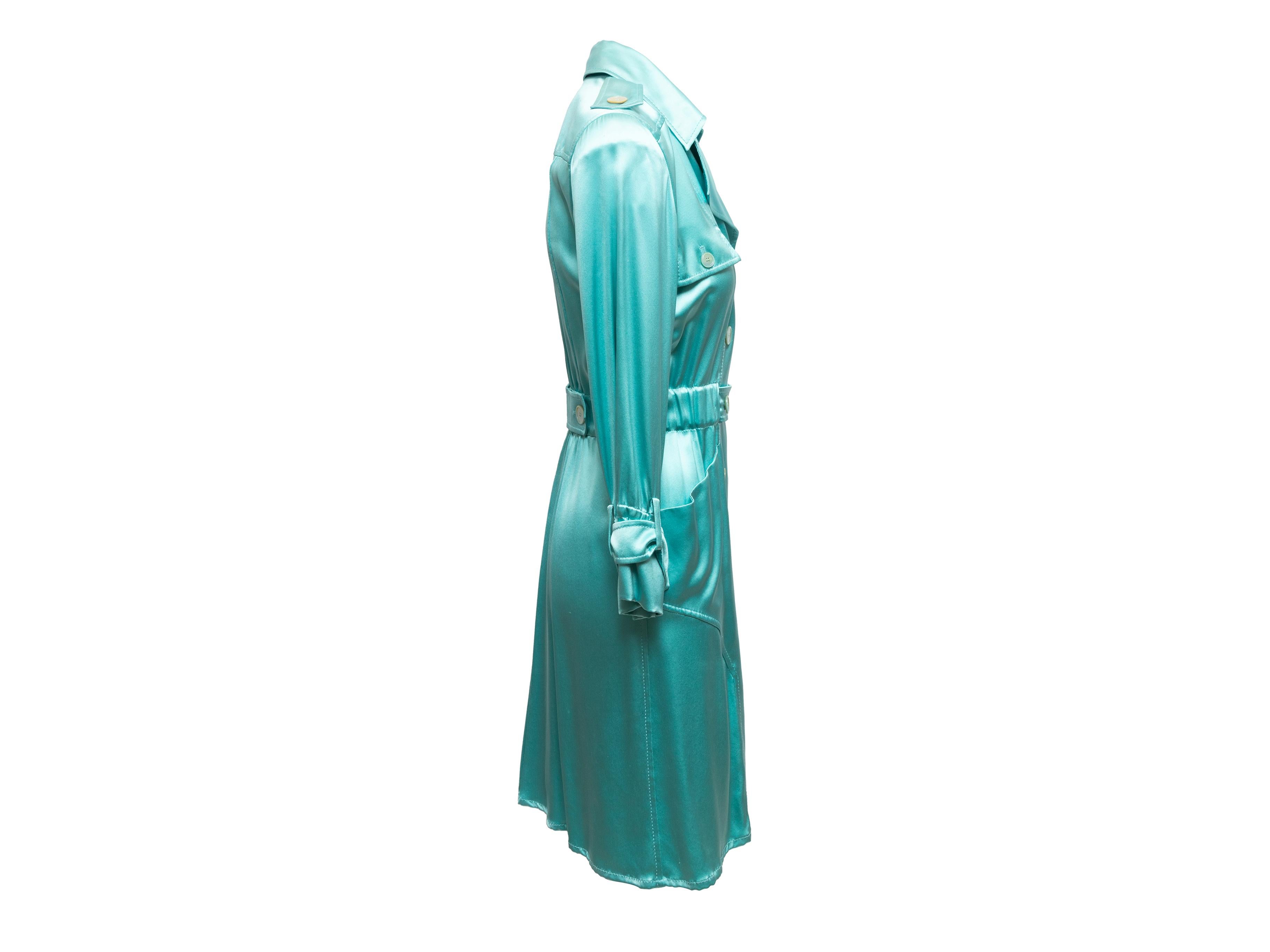 Product Details: Turquoise silk double-breasted dress by Valentino. Notched lapel. Dual hip pockets. Button closures at front. 34