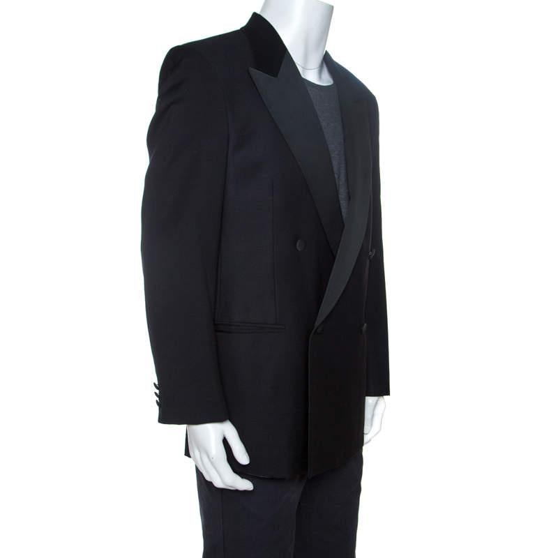 This blazer by Valentino is perfect for formal occasions. It has been crafted from 100% wool and carries a classic black shade. It is stylish, sophisticated and makes for a great buy. This double-breasted blazer is styled with button closure, long