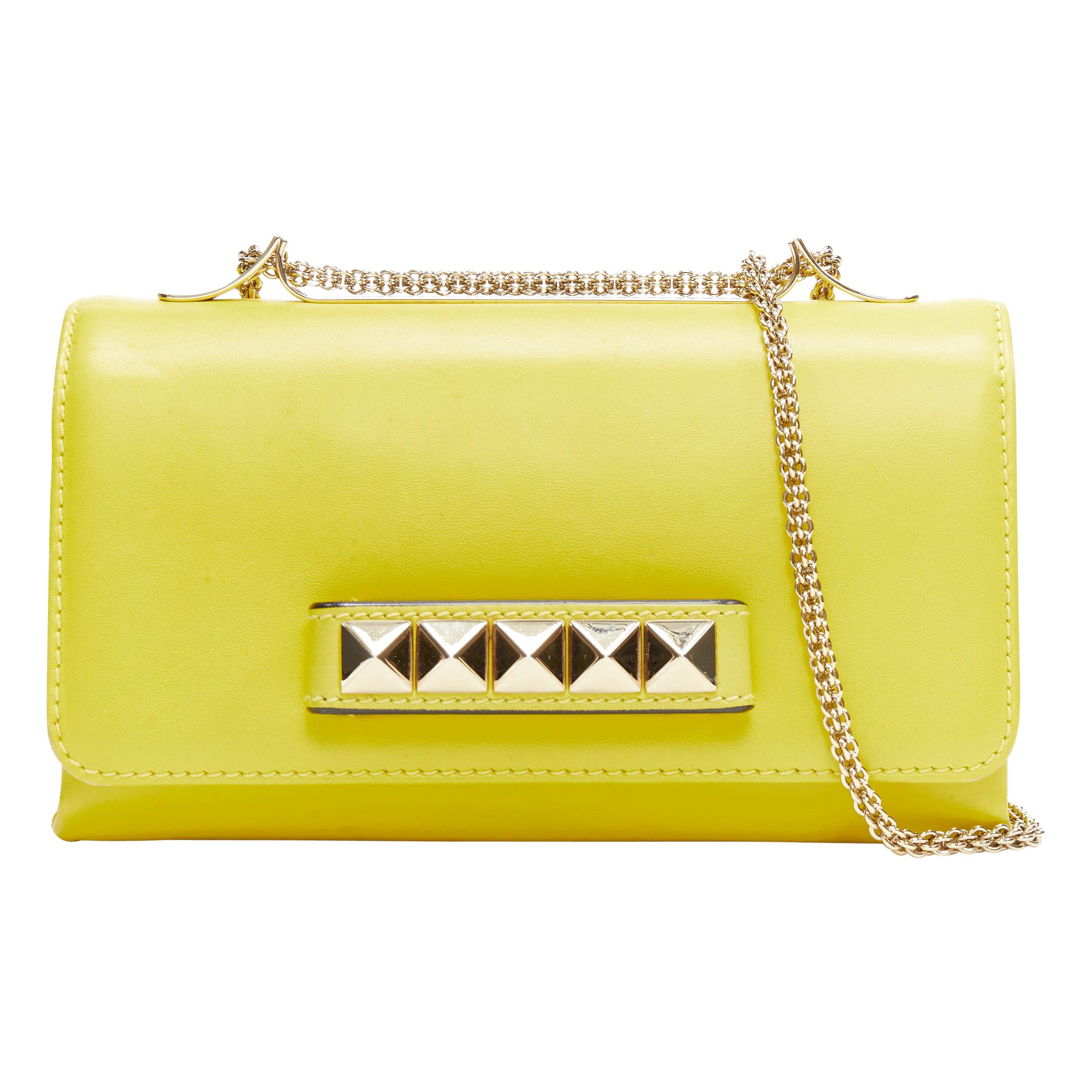 gold studded clutch bag