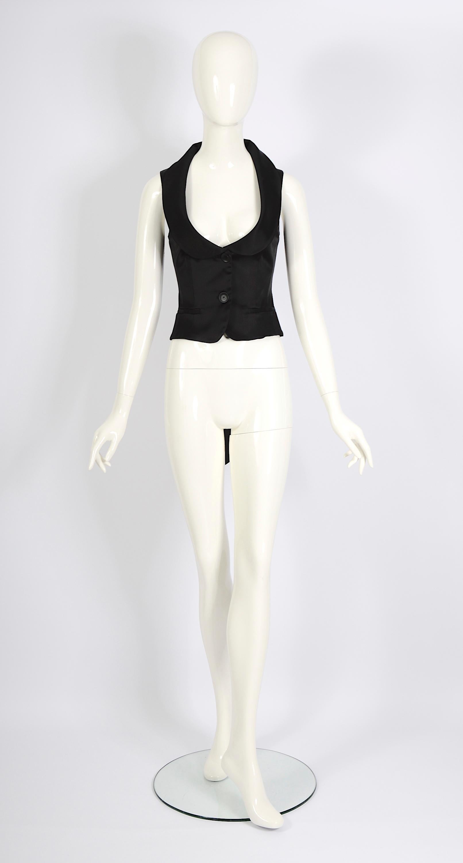 Upgrade your wardrobe with this stunning vintage 90s Valentino piece. This sleeveless black waistcoat 
vest top is simple yet stylish, featuring an open back tied with delicate silk ribbons. Add a touch of elegance to your look with this timeless