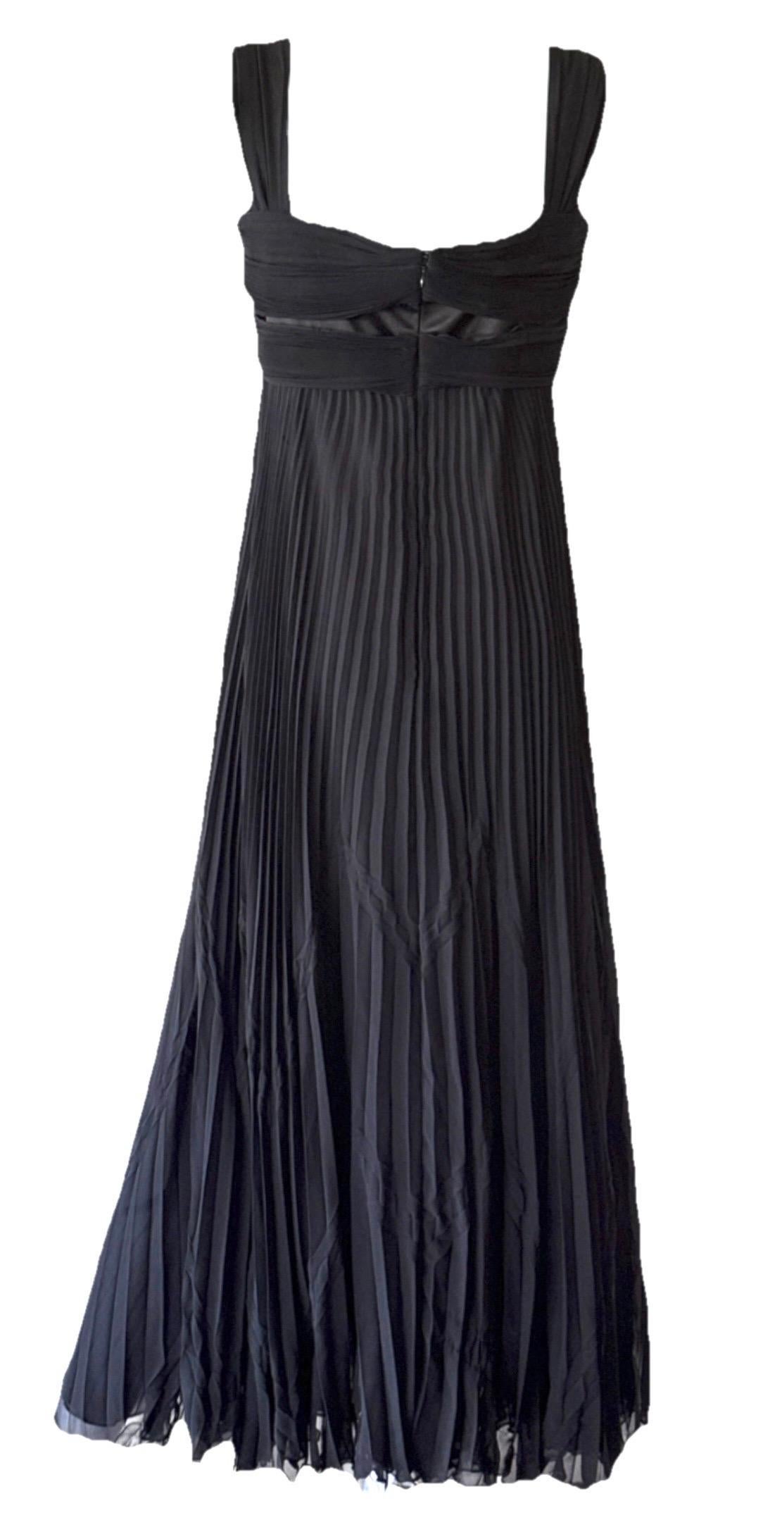 Exceptional Italian craftsmanship is the essence of this beautiful vintage Valentino evening dress, dating to the mid 2000’s.

Crafted in Italy from 100% silk, it features a twisted empire bustier neckline and a double-layered, delicately pleated