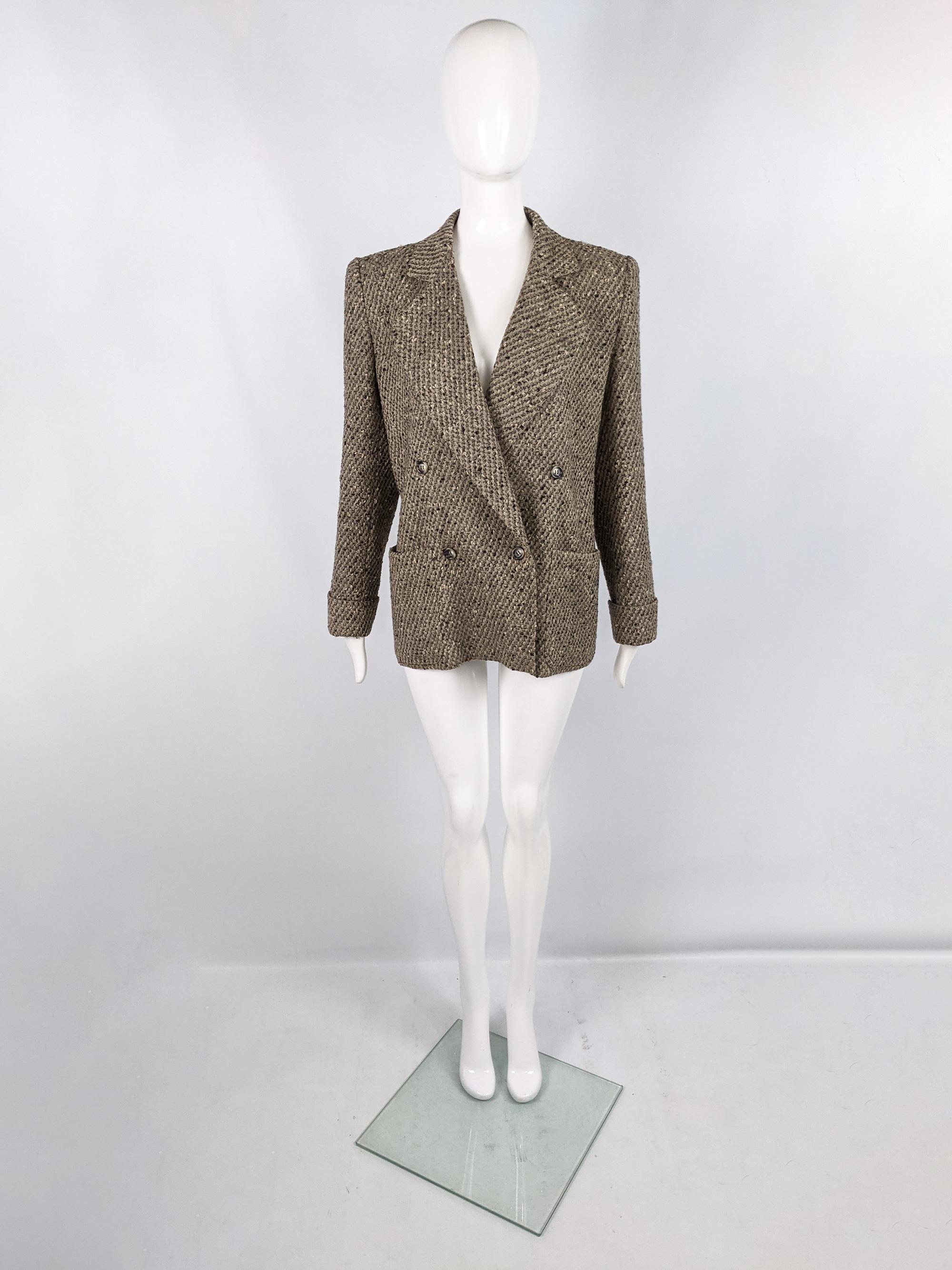 A chic vintage womens Valentino Miss V blazer jacket from the 80s. In a new wool tweed fabric with double breasted buttons, wide lapels and shoulder pads for a sharply tailored look. 

Size: Marked IT 44 which equates to a UK 12/ US 8/ EU 40 but