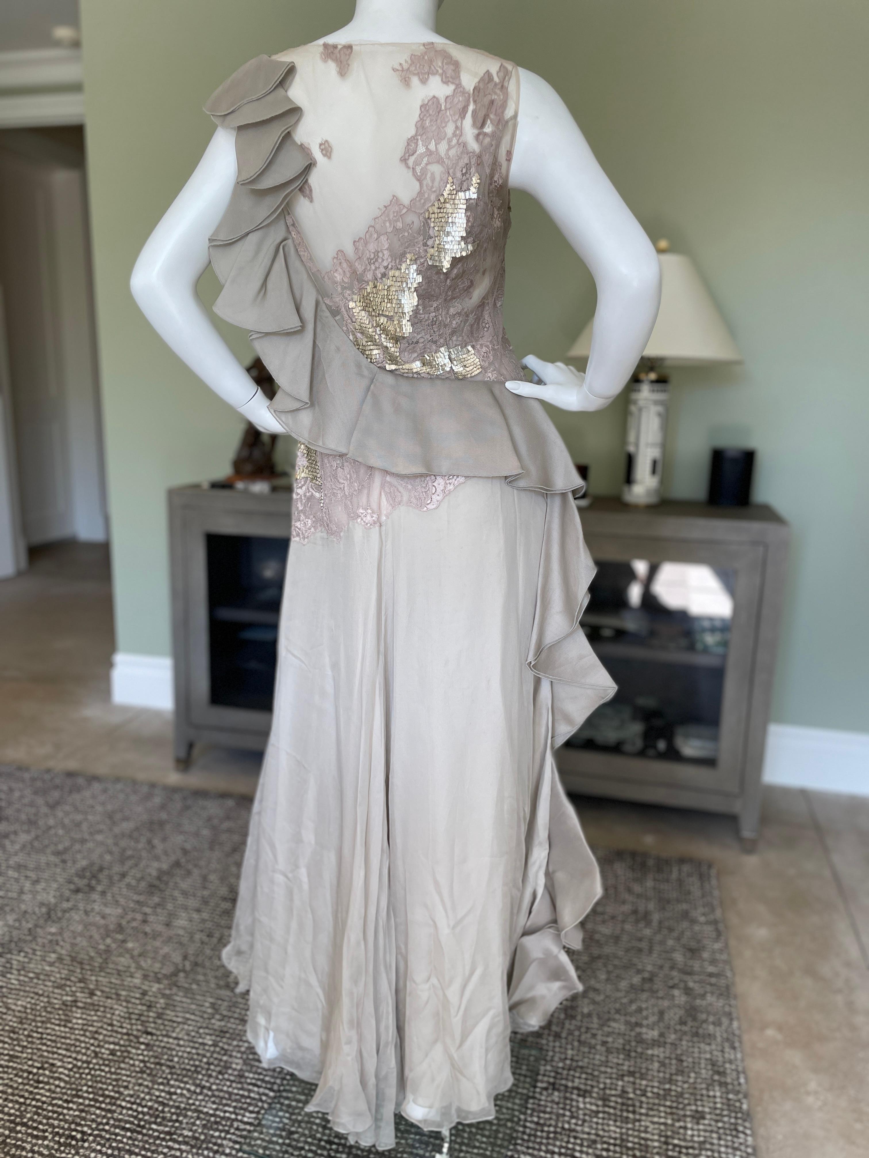 Valentino Vintage 80's Sheer Embellished Silk Evening Dress 
 Seductive sheer area's, with a swoop of ruffles around he back.
Beautiful bead work on the sheer tulle netting. I believe a lot of the beads are glass, there is some weight to this.
 This