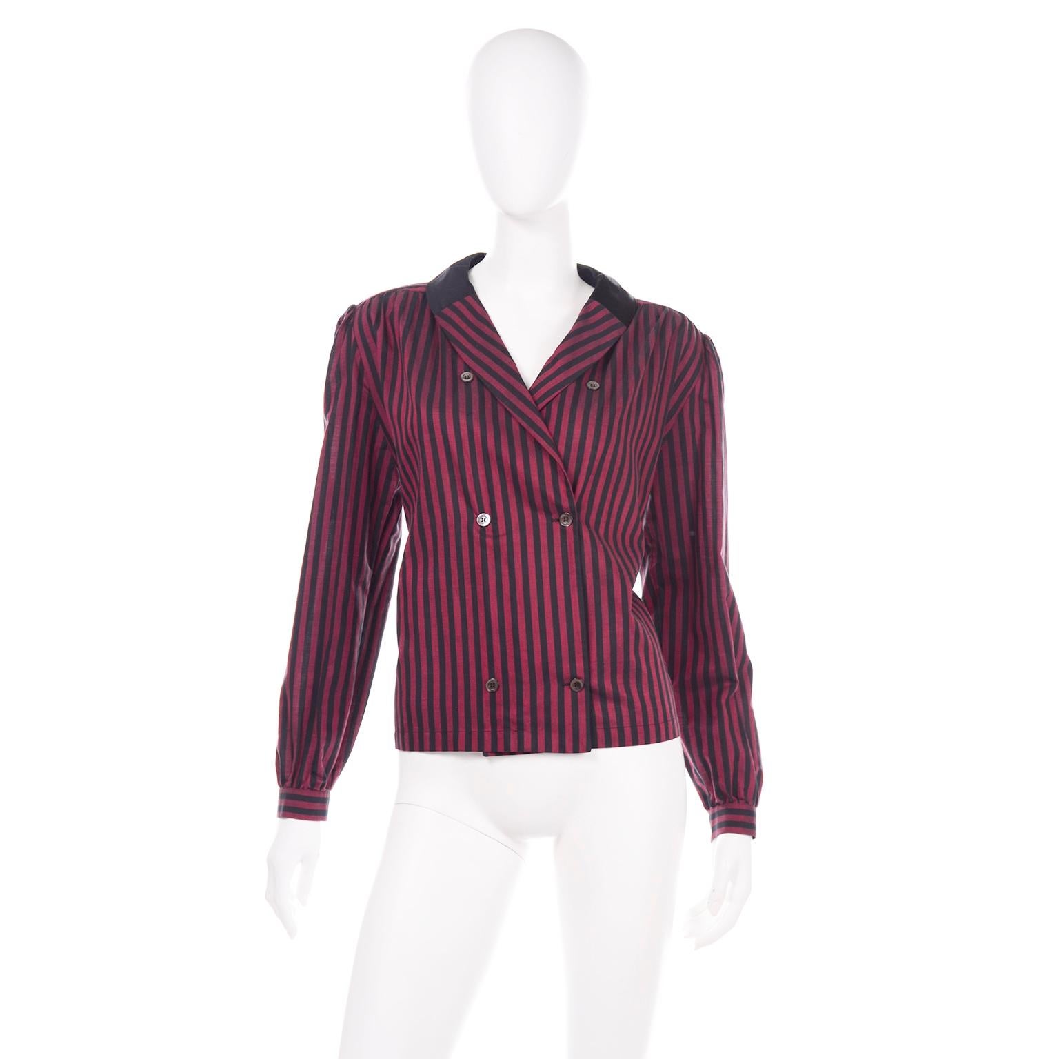 This is a great vintage blouse from Valentino in a red and black striped cotton with a black silk collar. This boxy, double breasted button front blouse has 2 functional buttons, one on the outside, and one on the inside. 3 of the front buttons are