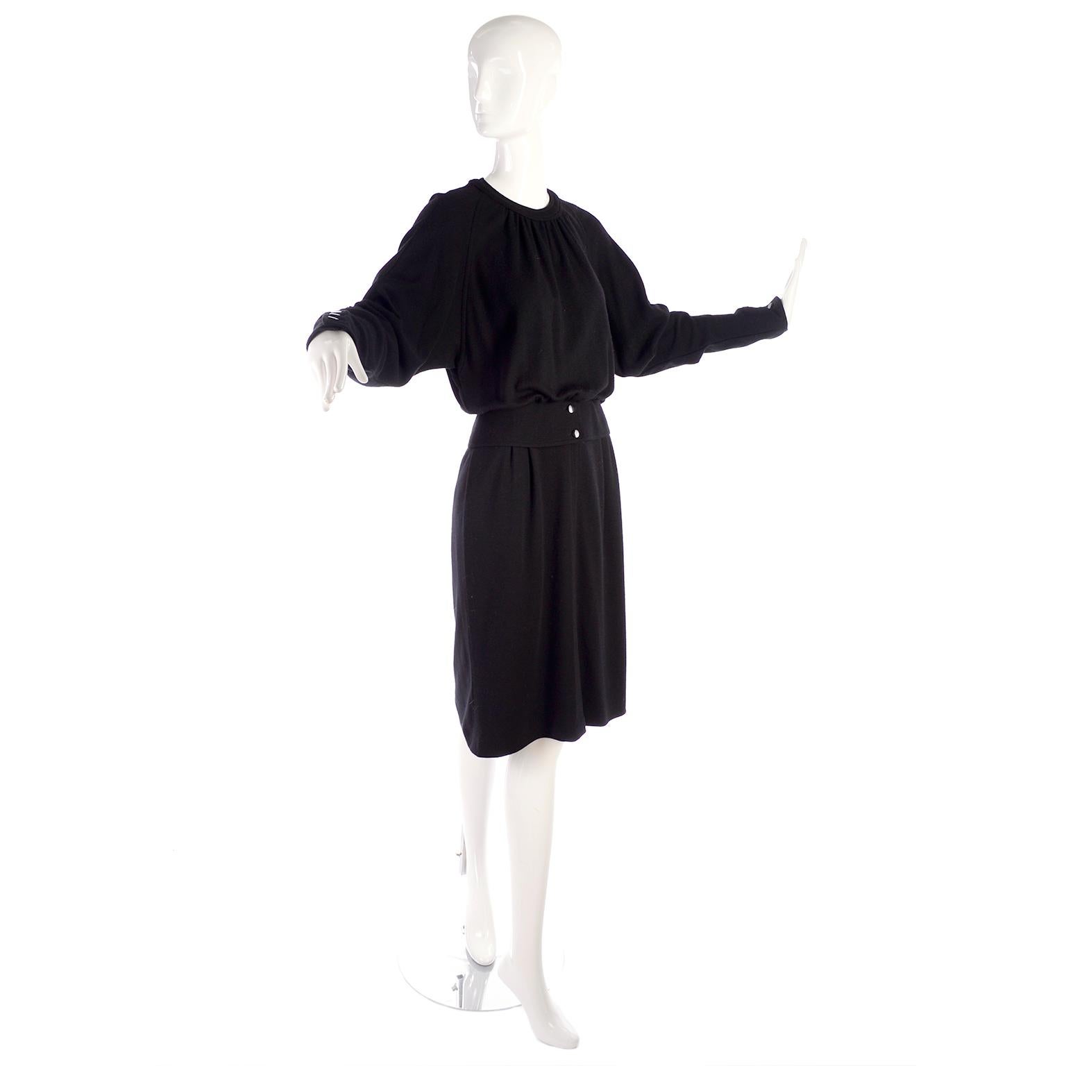 This is a timeless Valentino vintage wool dress that is fully lined in rayon. The late 1980's dress has a blousy,  gathered bodice and though it is a dress, it has the appearance of a skirt and top.  This Valentino Miss V labeled wool dress is