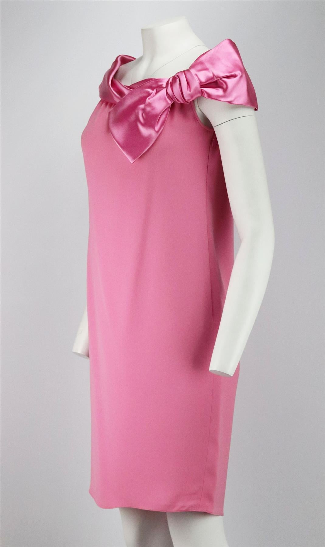 This vintage dress by Valentino is made from bright-pink silk satin and crepe, it has draped bow detail along the neckline in silk-satin and a slim silhouette body in crepe. Pink silk. Concealed zip fastening at side. 100% Silk; lining: 100% silk.