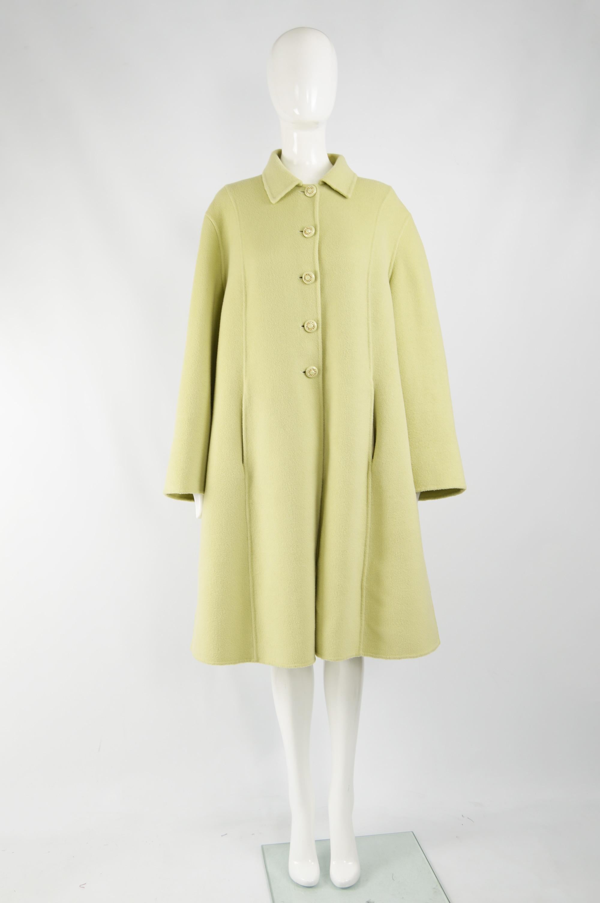 A beautiful vintage womens Valentino evening / opera coat from the 80s. In a pastel green incredibly soft cashgora (a rare crossbreed of a cashmere goat and Russian fiber goat). With a trapeze / swing fit, it has self covered buttons embellished