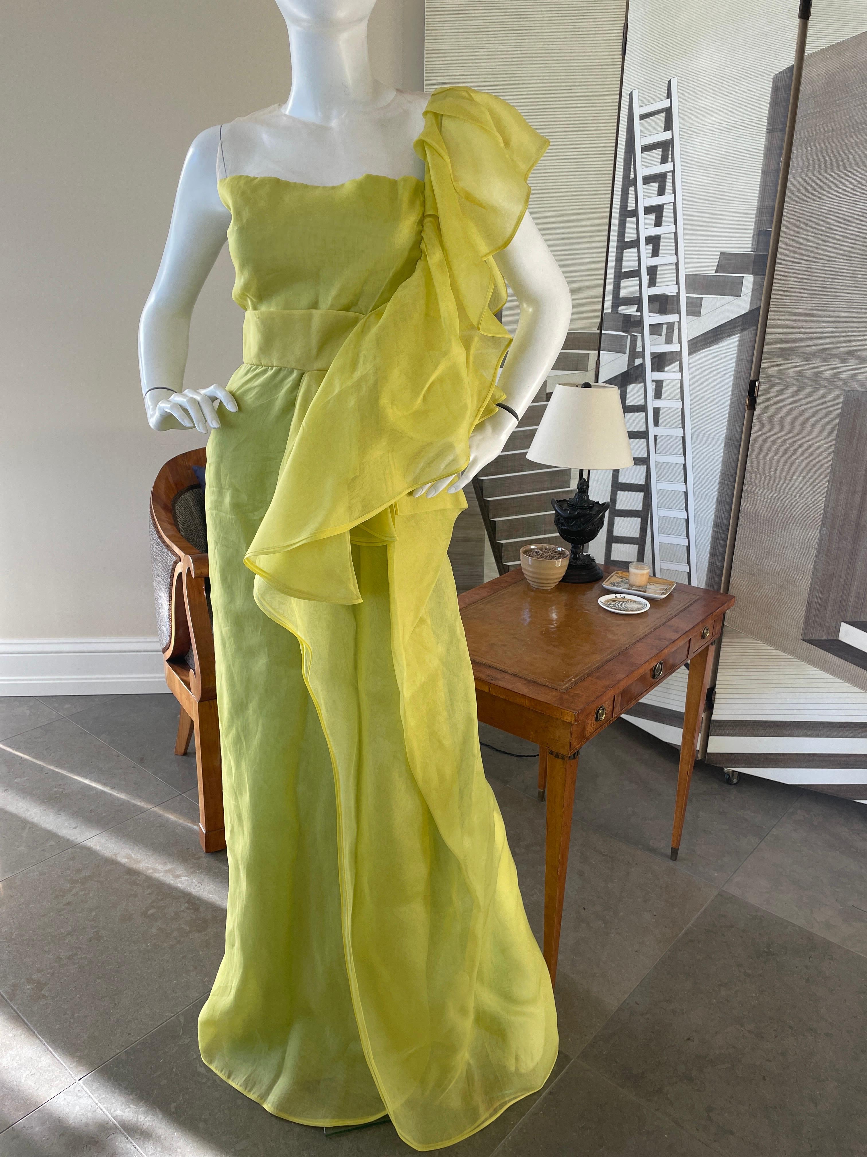 Valentino Vintage Acid Green Silk Evening Dress with Sheer Bodice and Grand Ruffle.
This is outstanding ,with sheer netting on top, and an exaggerated ruffle sweeping from one shoulder to the floor.
This is so pretty
Size 6
  Bust 34