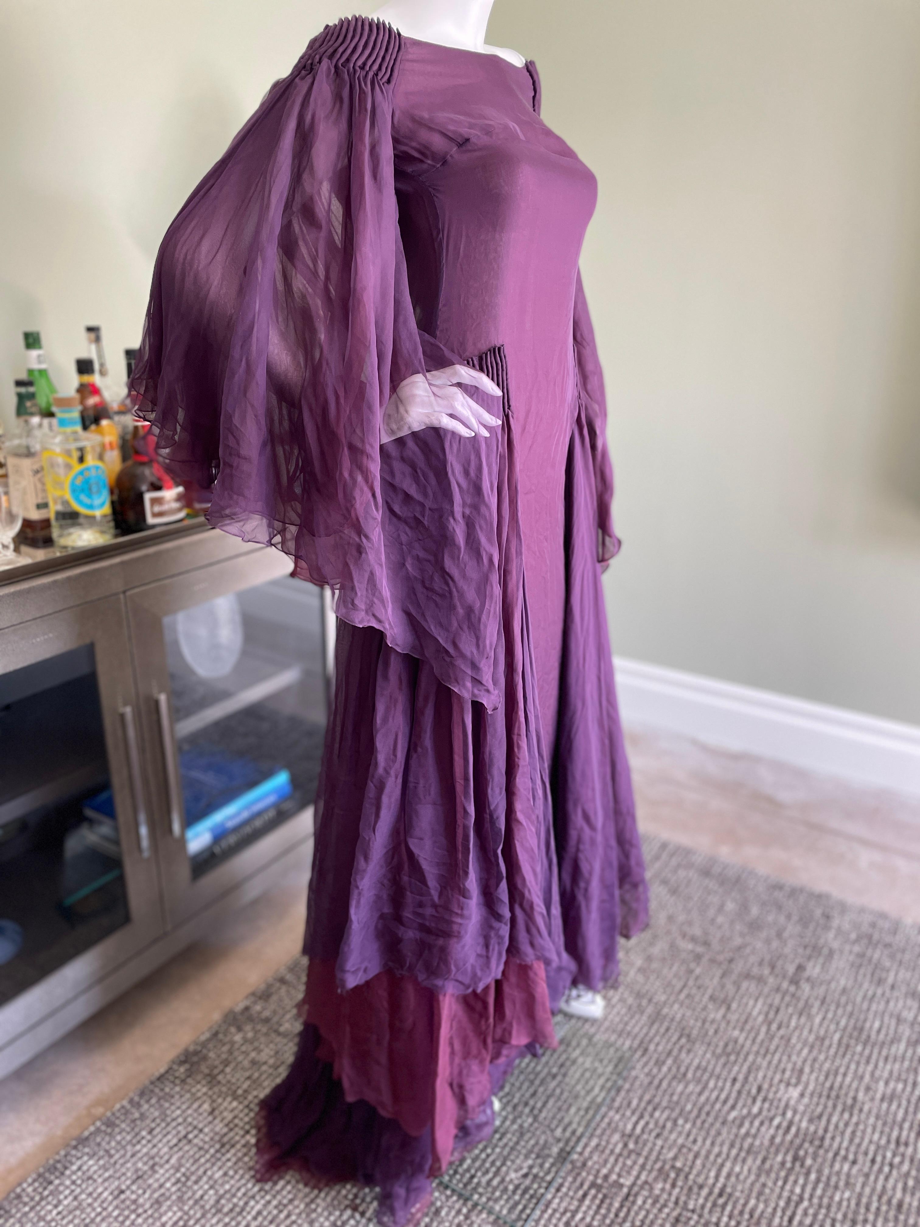 Valentino Vintage Purple Silk Chiffon Ethereal Evening Dress.
This is so beautiful, with romantic flutter sleeves and flowing panels at the hips.
It's too small for my mannequin, the zipper works, I didn't want to force it. 
 This is vintage 1990's
