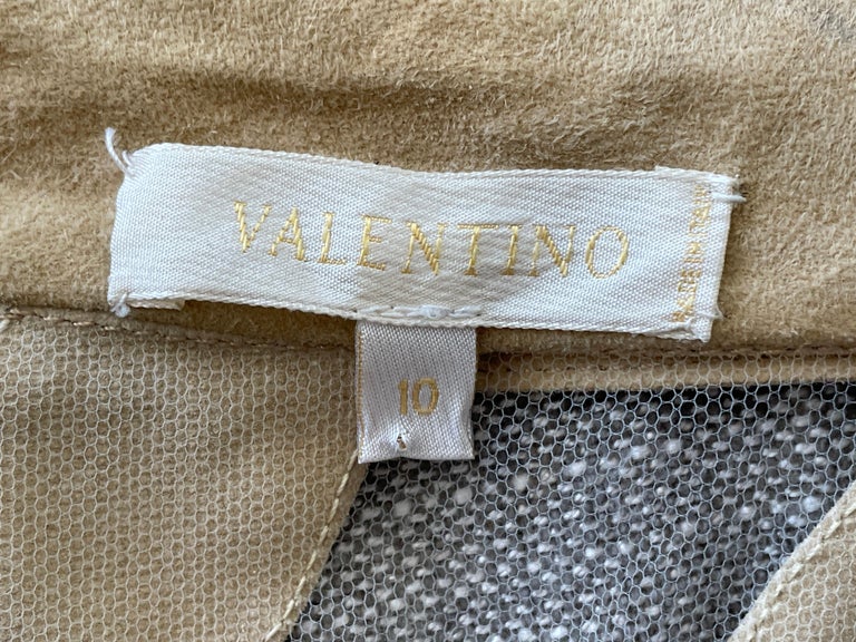Valentino Vintage Sheer Suede and Leather Embellished Evening Jacket.
Created on sheer tulle, this features large rings in two colors of lambskin suede and leather alternating with crystal beaded rings. 
 Size 10  but seems to run small
 Bust