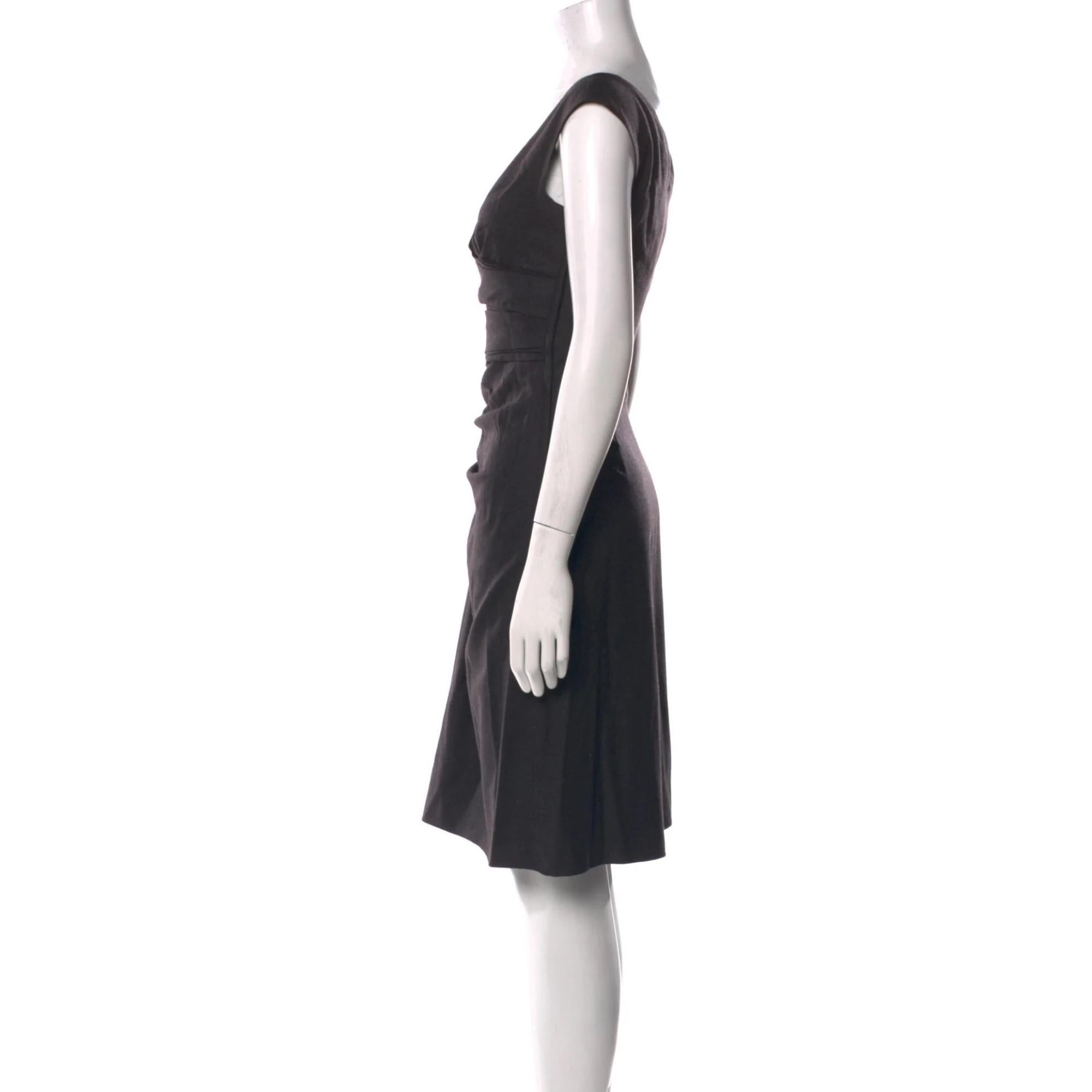 Valentino Virgin Wool Dress. Grey. Sleeveless with V-Neck Concealed Zip Closure at Side. Designer Fit: Dresses by Valentino typically fit true to size.

Color: Black
Material: 100% Virgin Wool; Lining 100% Silk
Condition: Excellent
Size: S  US