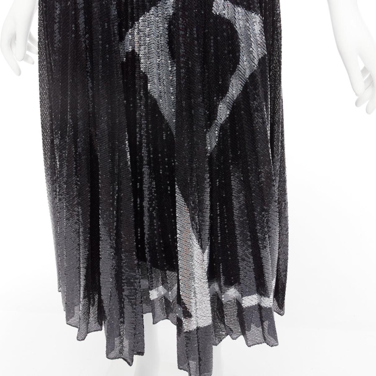 VALENTINO VLOGO black silver sequins embellished pleated plisse midi skirt XS
Reference: AAWC/A00588
Brand: Valentino
Designer: Pier Paolo Piccioli
Collection: VLOGO
Material: Polyester
Color: Black, Silver
Pattern: Logomania
Closure: Zip
Lining: