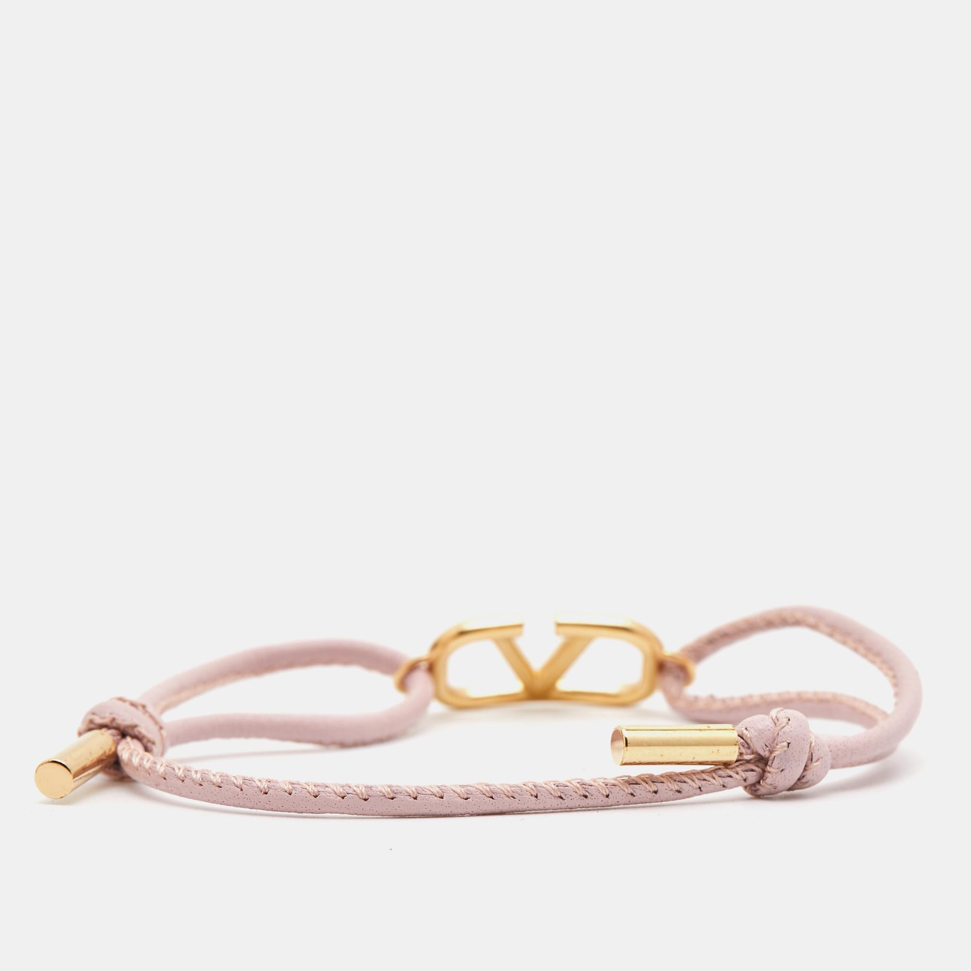 Add Valentino's magic to the way you accessorize with this bracelet. It has a simple leather string and the VLOGO in gold-tone metal.

