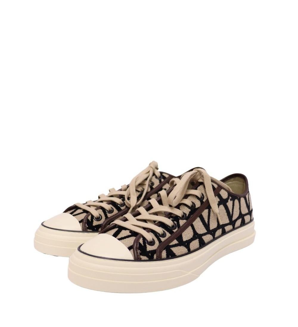 Step up your casual game with these chic Valentino Garavani canvas logo sneakers. Featuring an all-over bold 