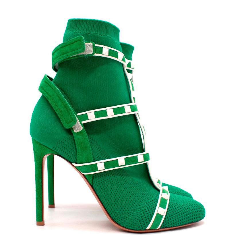 Valentino VLTN White Rockstud Green Sock Heeled Boots
 

 - Part of the VLTN line, featuring signature rockstuds rendered in white
 - Stretchy green knitted sock boot shape, with studded leather lattice over the top
 - Pull-on style with velco