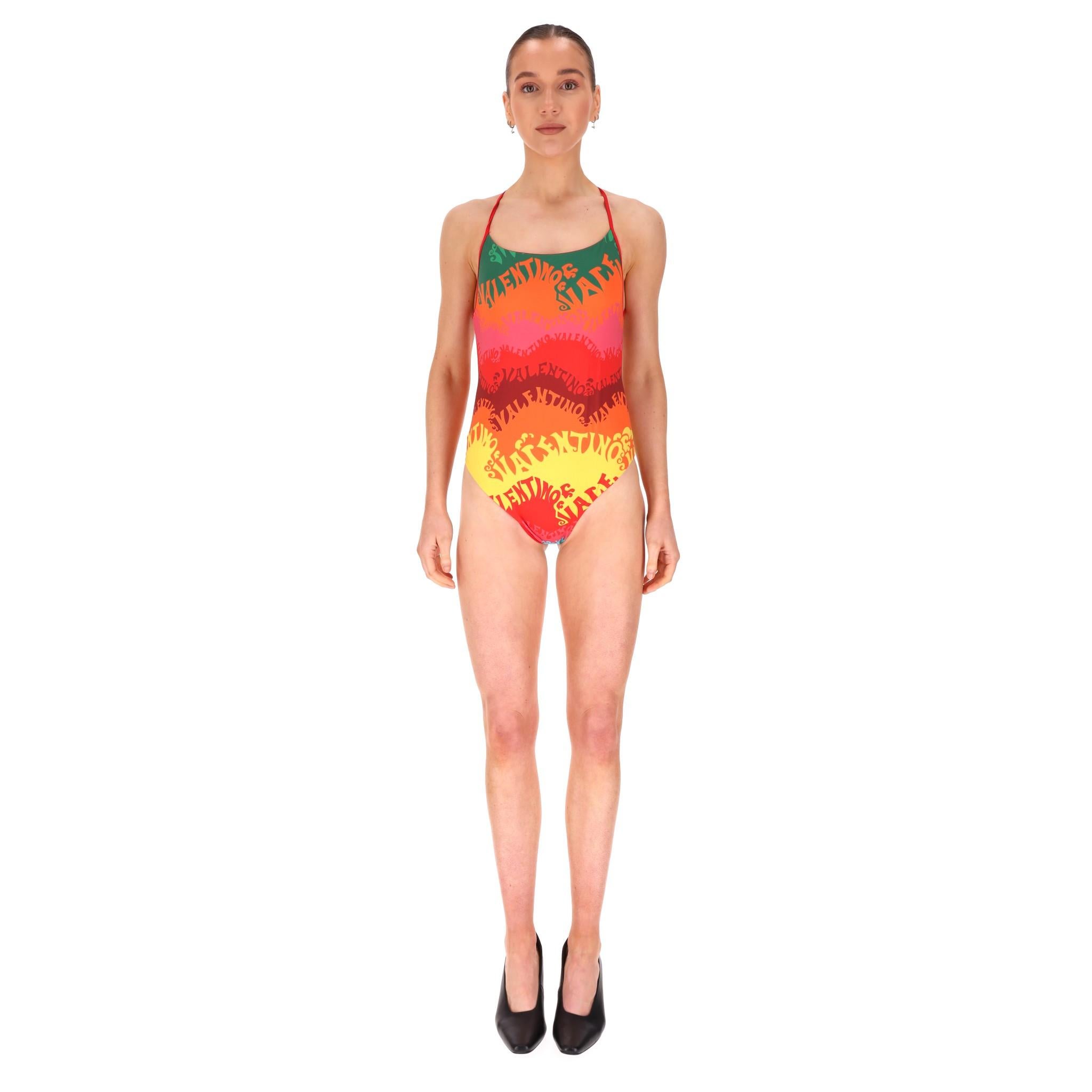 Valentino Waves Logo Printed Swimsuit & Silk Beach Cover-Up Set

Multicoloured swimsuit and cover-up from Valentino x Mytheresa's Exclusive Escape Capsule, designed with 'Valentino' signature weave vibrant prints.

Lycra swimsuit featuring thin